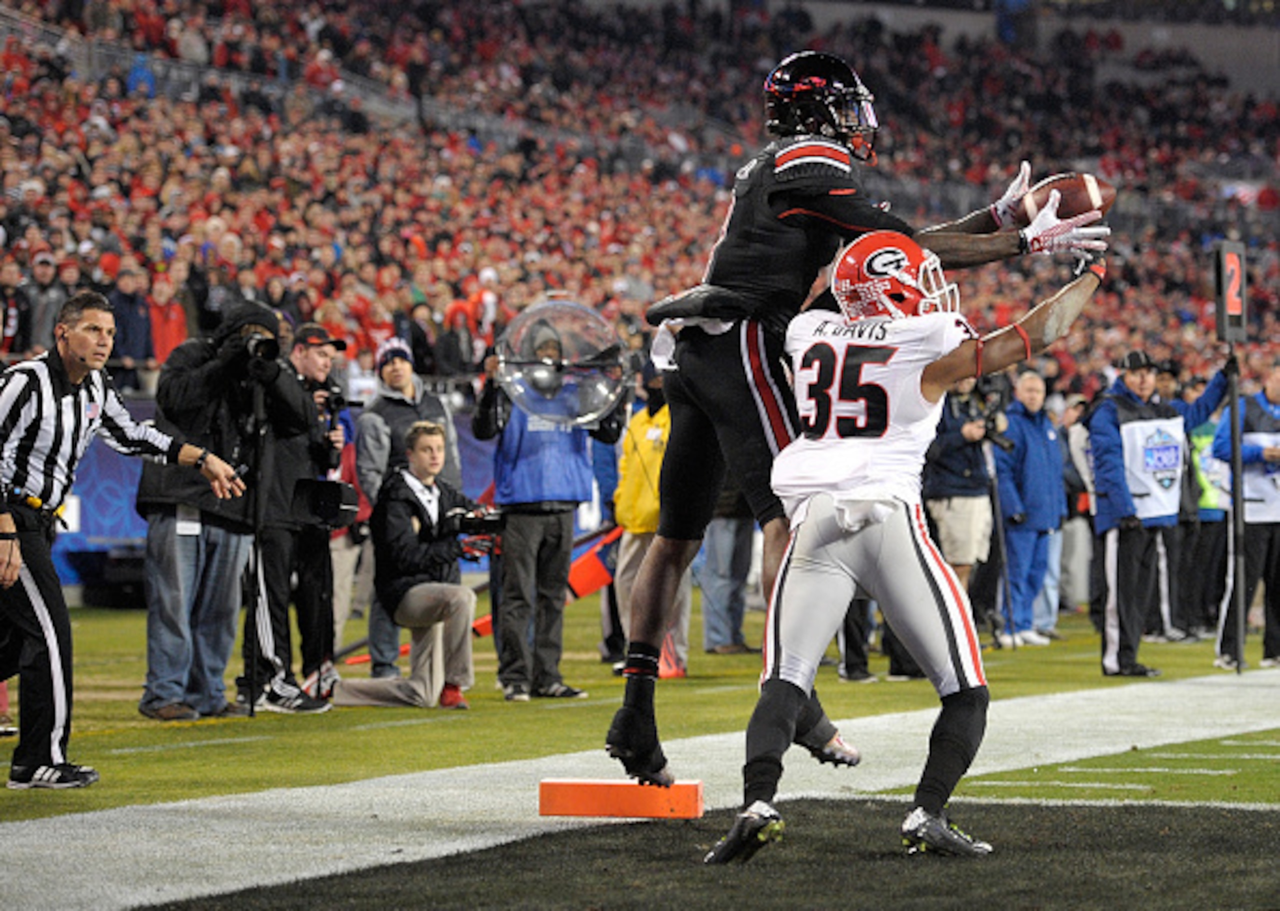 Davis goes to make a play in the Belk Bowl.