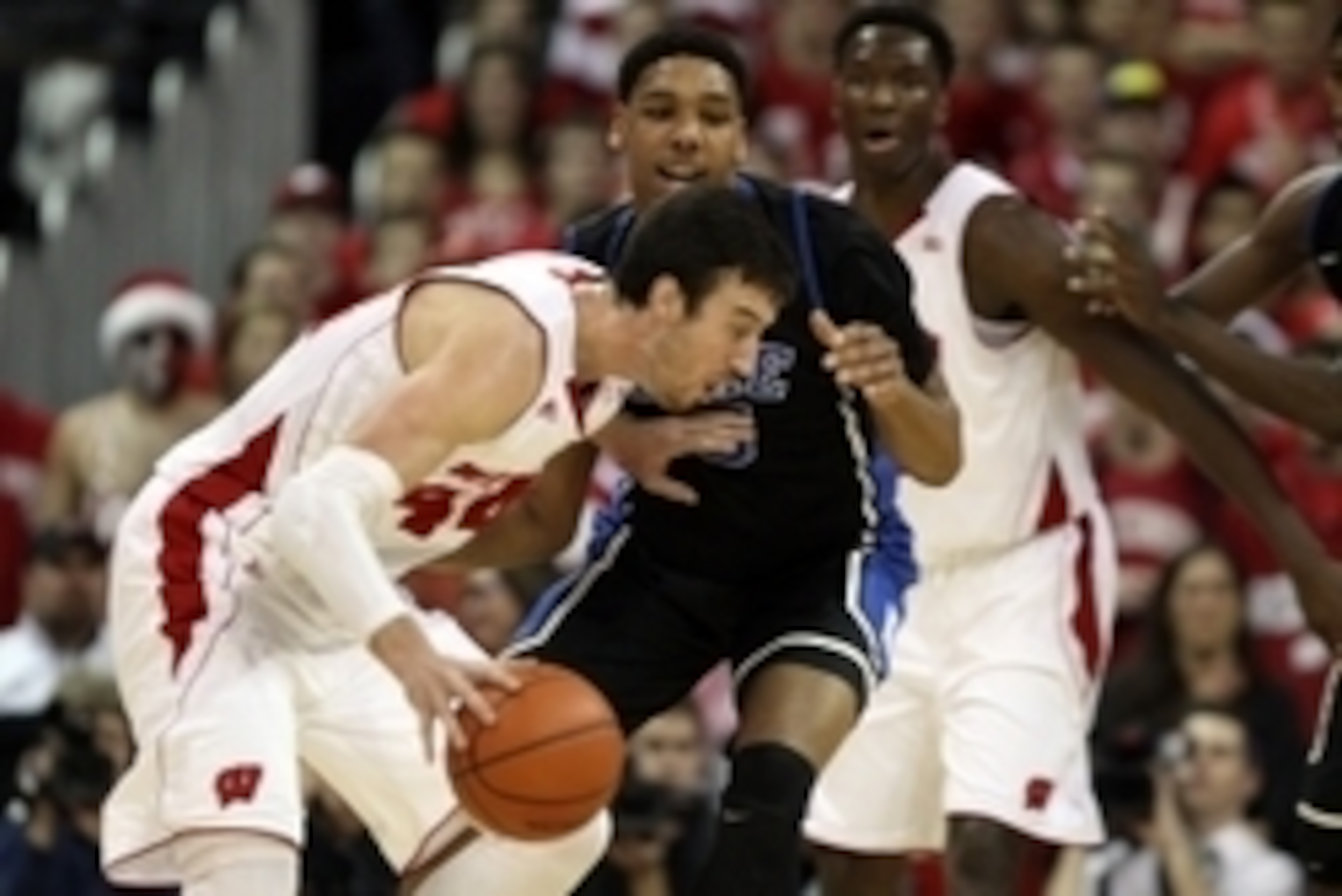 Wisconsin's Frank Kaminsky (left) and Duke's Jahlil Okafor (center) are two of the 15 finalists for the John R. Wooden Award.
