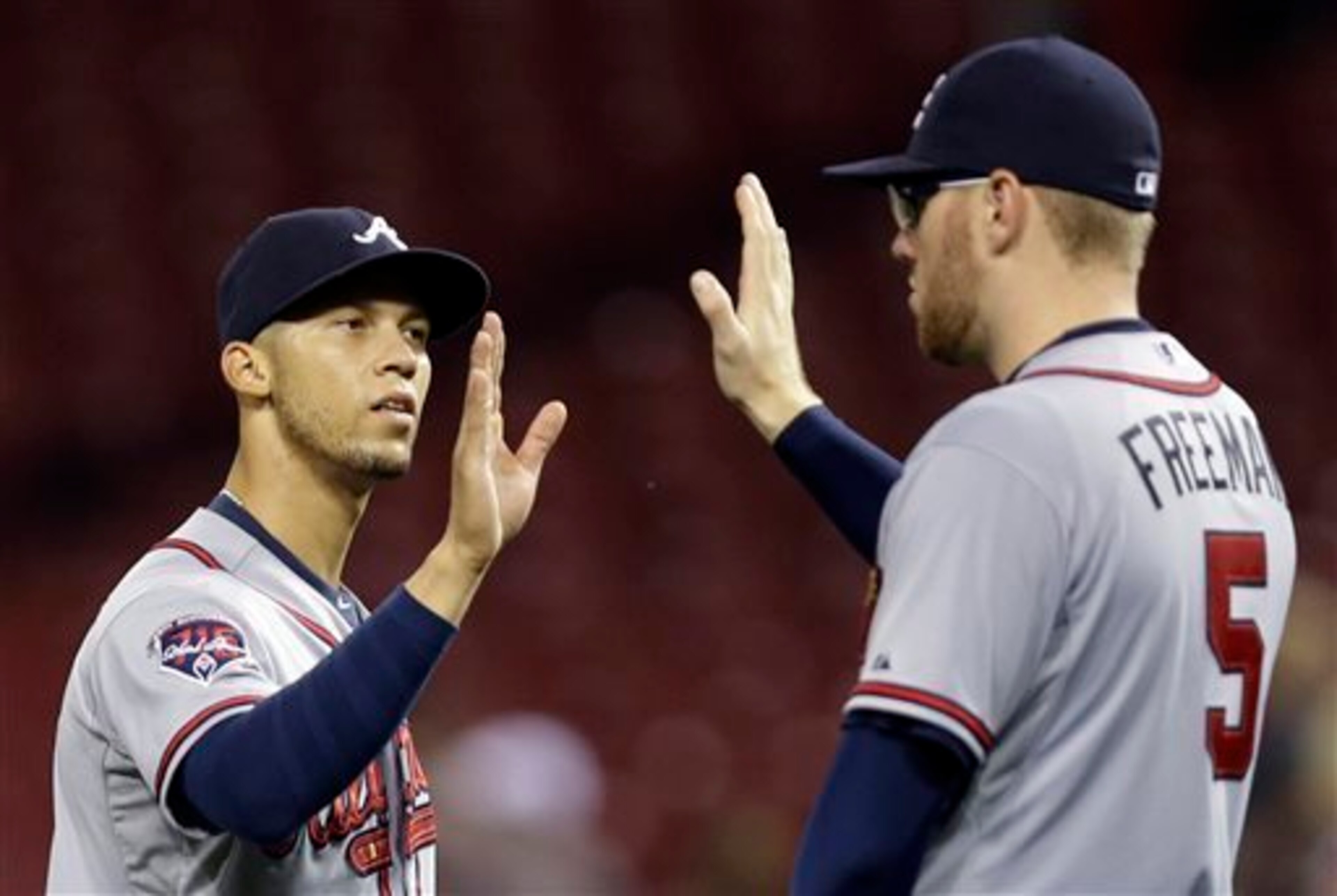 The Braves' major league roster has been gutted, but Andrelton Simmons (L) and Freddie Freeman (R) are among the controllable stars who remain.