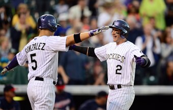 The contracts of Carlos Gonzalez (L) and Troy Tulowitzki (R) won't make Colorado's rebuilding phase any easier.