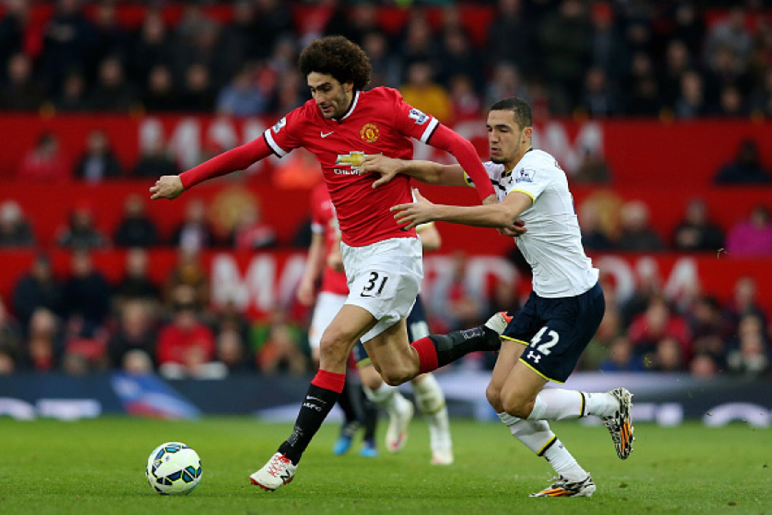 Marouane Fellaini keeps Nabil Bentaleb at arm's length. Manchester United did the same to Tottenham Hotspur all afternoon. Marouane Fellaini keeps Nabil Bentaleb at arm's length. Manchester United did the same to Tottenham Hotspur all afternoon.