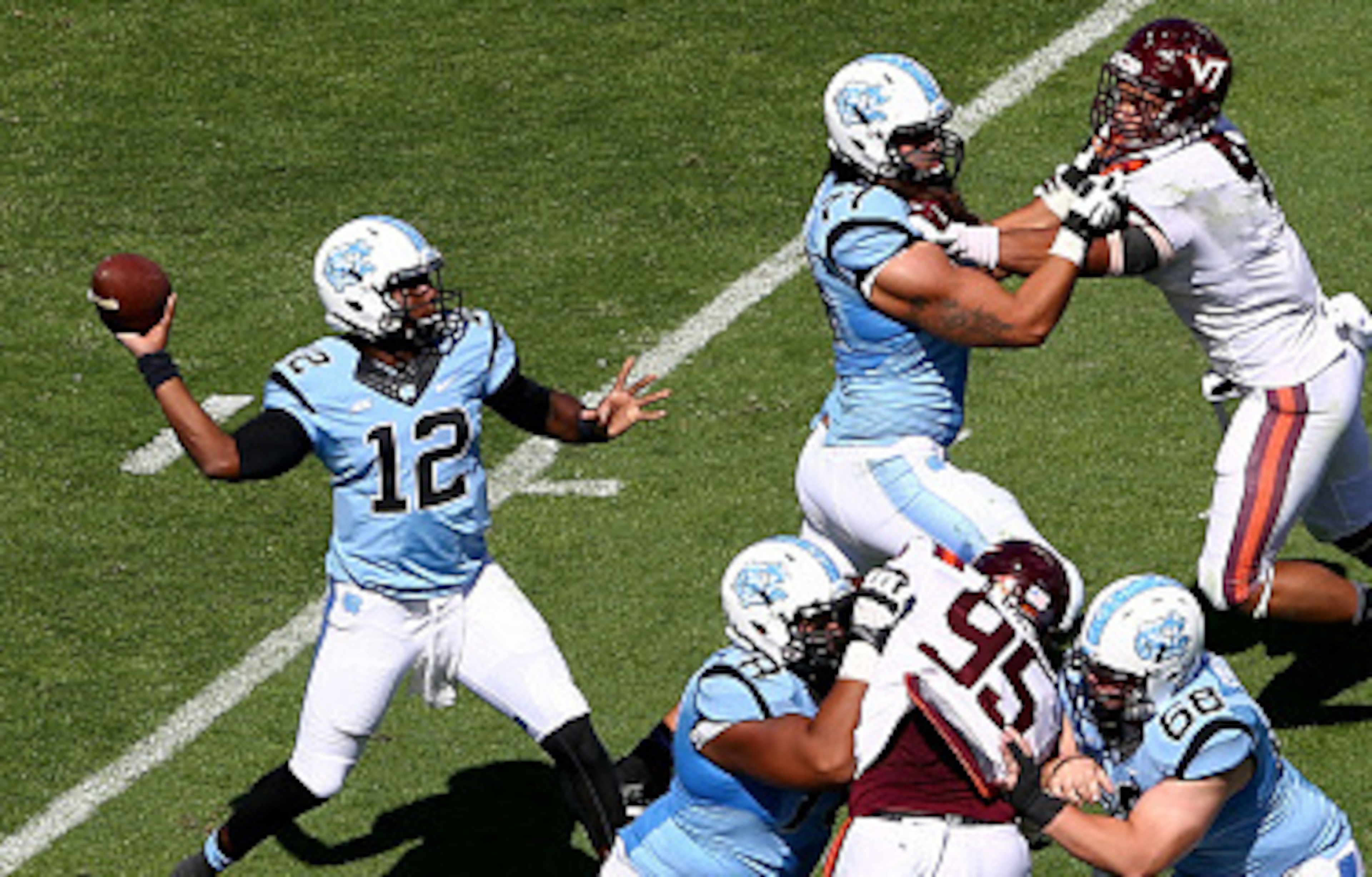 CHAPEL HILL, NC - OCTOBER 04: Marquise Williams #12 of the North Carolina Tar Heels drops back to pass against the Virginia Tech Hokies during their game at Kenan Stadium on October 4, 2014 in Chapel Hill, North Carolina. (Photo by Streeter Lecka/Getty CHAPEL HILL, NC - OCTOBER 04: Marquise Williams #12 of the North Carolina Tar Heels drops back to pass against the Virginia Tech Hokies during their game at Kenan Stadium on October 4, 2014 in Chapel Hill, North Carolina. (Photo by Streeter Lecka/Getty