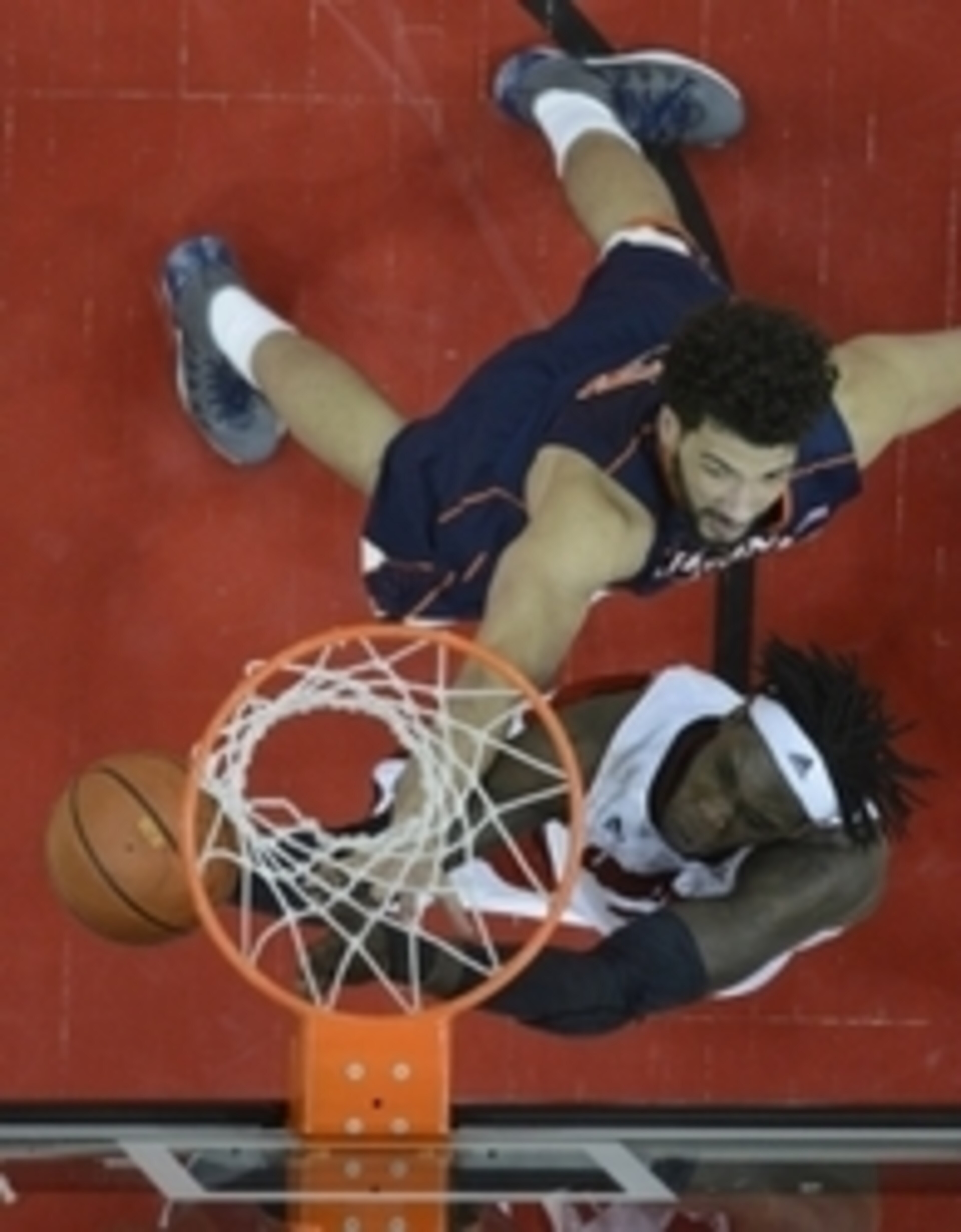 Virginia's Anthony Gill and Louisville's Montrezl Harrell battle under the basket Virginia's Anthony Gill and Louisville's Montrezl Harrell battle under the basket