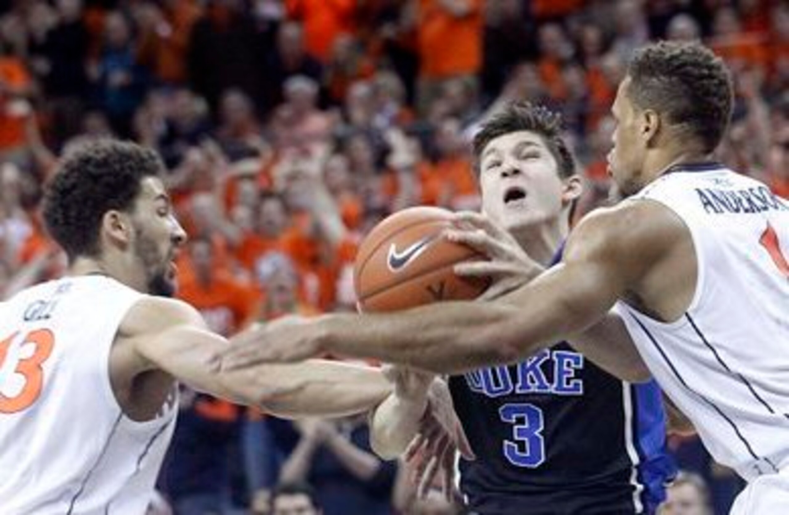 Duke's Grayson Allen tries to get past UVa's Anthony Gill and Justin Anderson on January 31