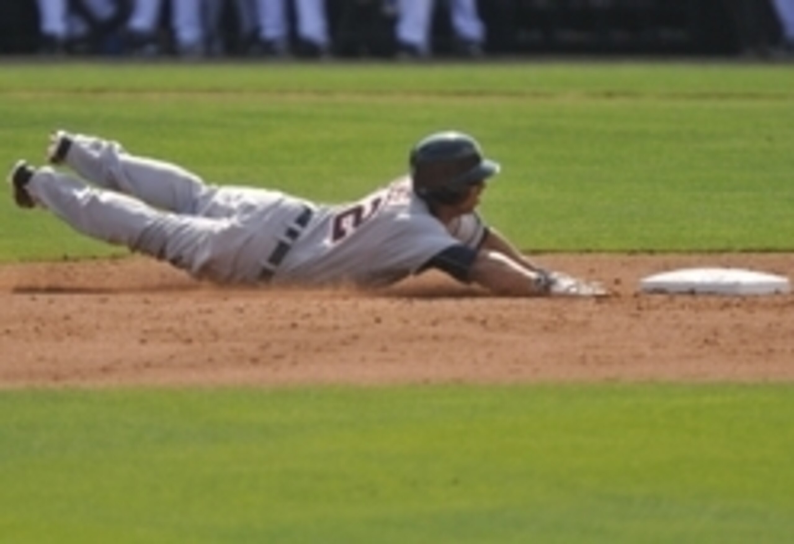 Mar 6, 2015; Port St. Lucie, FL, USA; Detroit Tigers center fielder Anthony Gose (12) attempts to steal second base against the New York Mets during a spring training baseball game at Tradition Field. Mandatory Credit: Brad Barr-USA TODAY Sports