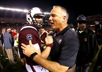 Former South Carolina QB Dylan Thompson (left) and Georgia head coach Mark Richt