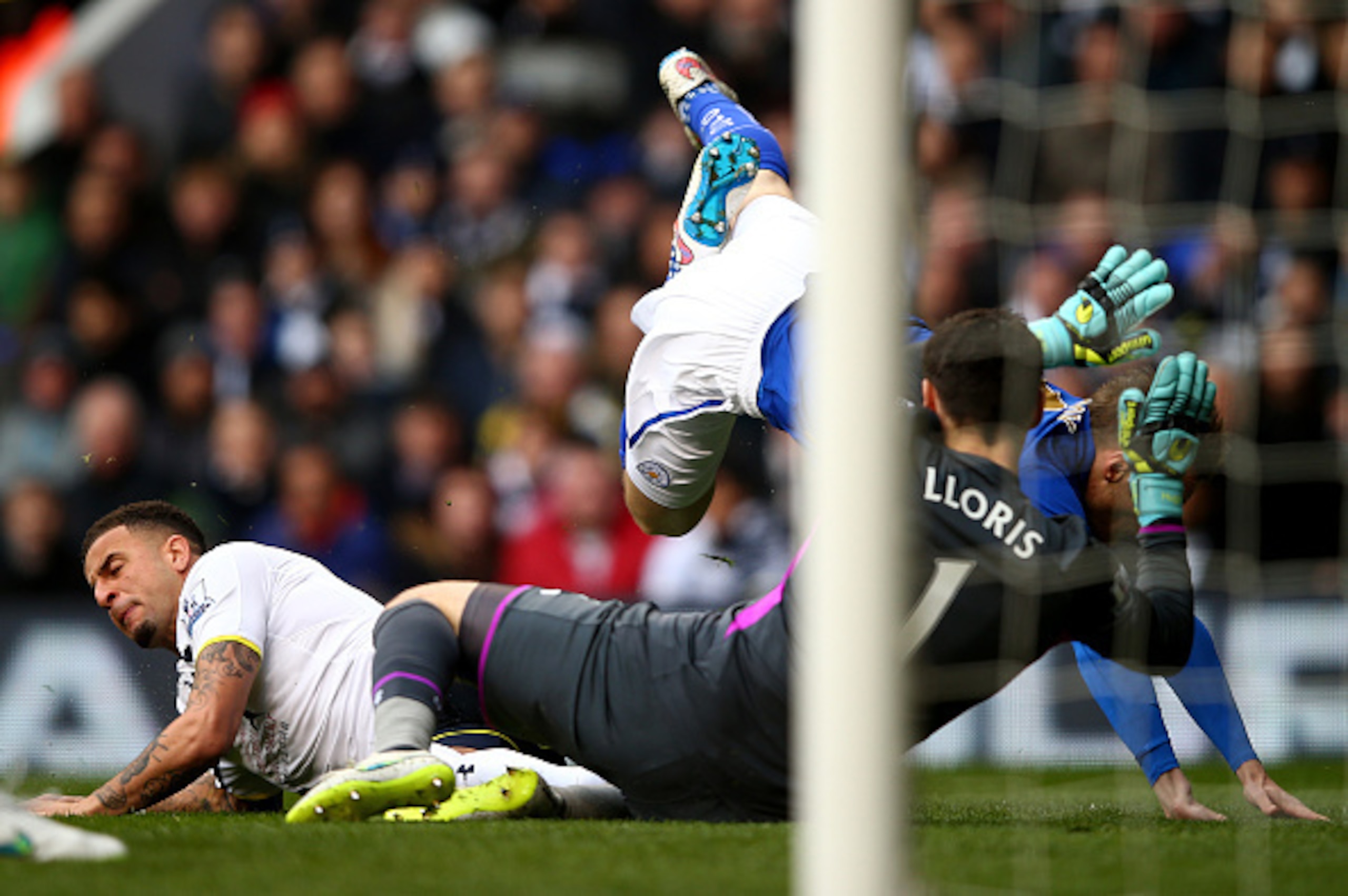 LONDON, ENGLAND - MARCH 21:  Hugo Lloris of Spurs picks up an injury after colliding with Kyle Walker of Spurs and Jamie Vardy of Leicester City during the Barclays Premier League match between Tottenham Hotspur and Leicester City at White Hart Lane on Ma