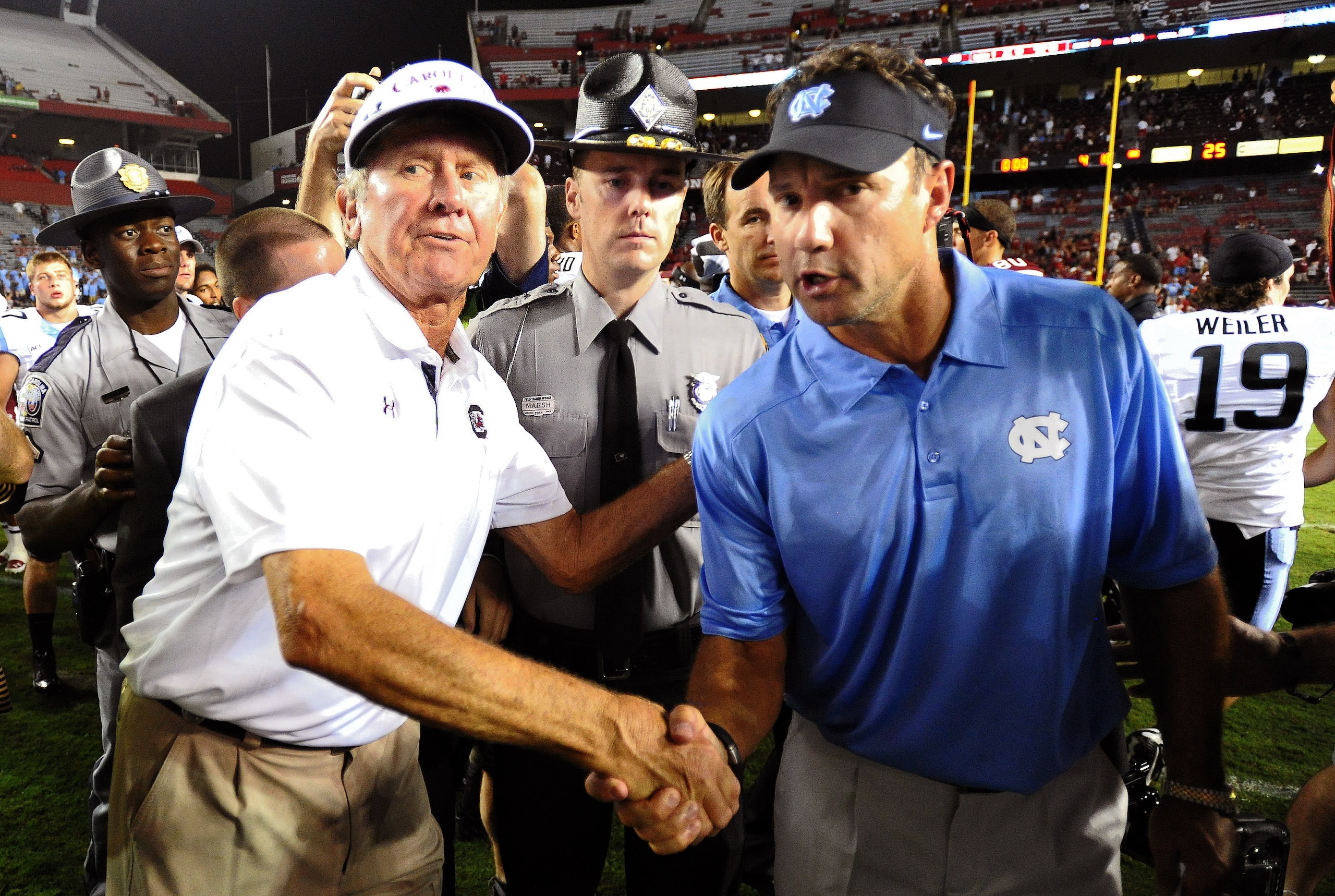 South Carolina head coach Steve Spurrier (left) and North Carolina head coach Larry Fedora (right)