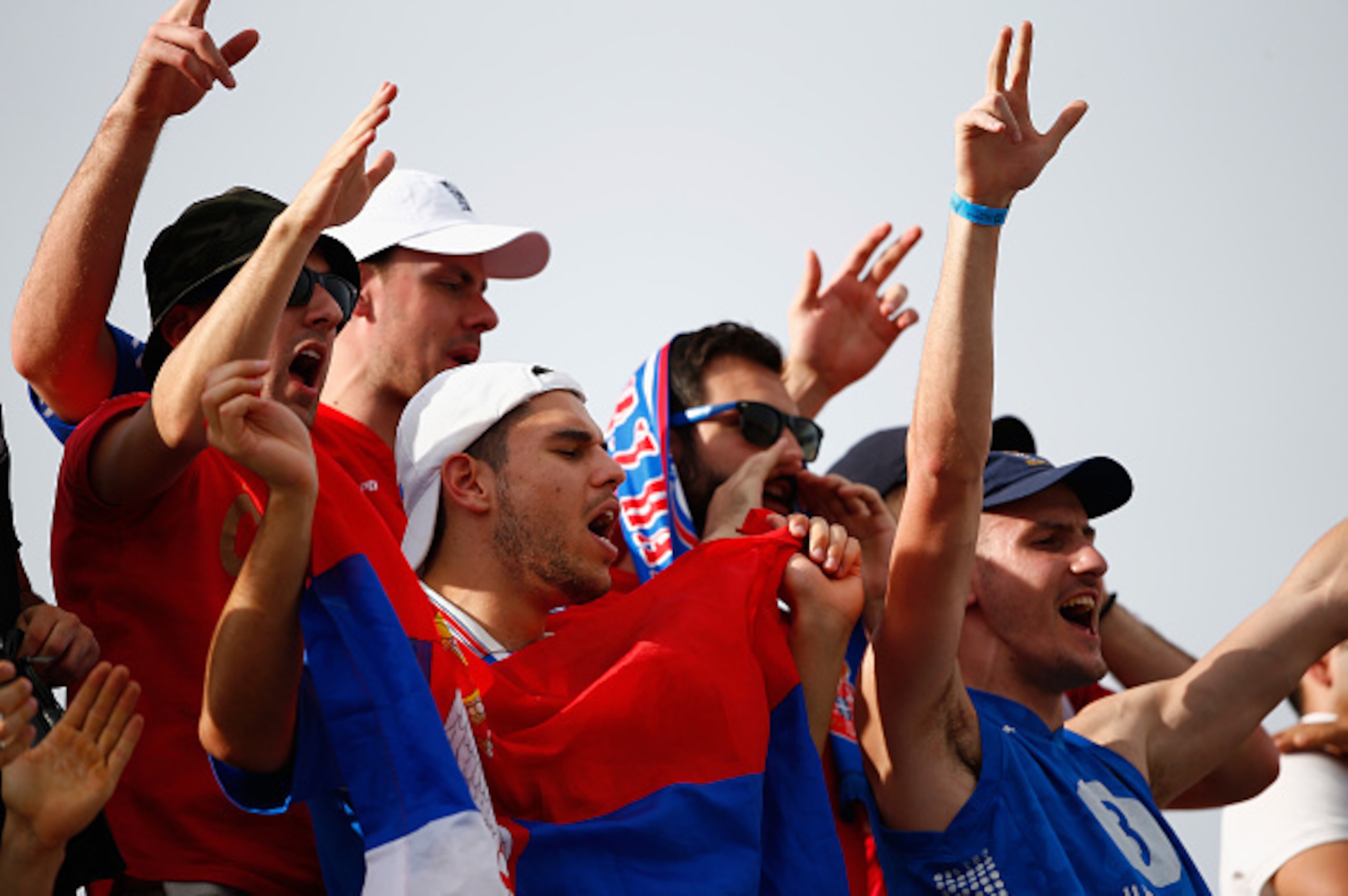 INDIAN WELLS, CA - MARCH 22:  Fans of Novak Djokovic of Serbia show their support against Roger Federer of Switzerland in the final during day fourteen of the BNP Paribas Open tennis at the Indian Wells Tennis Garden on March 22, 2015 in Indian Wells, Cal