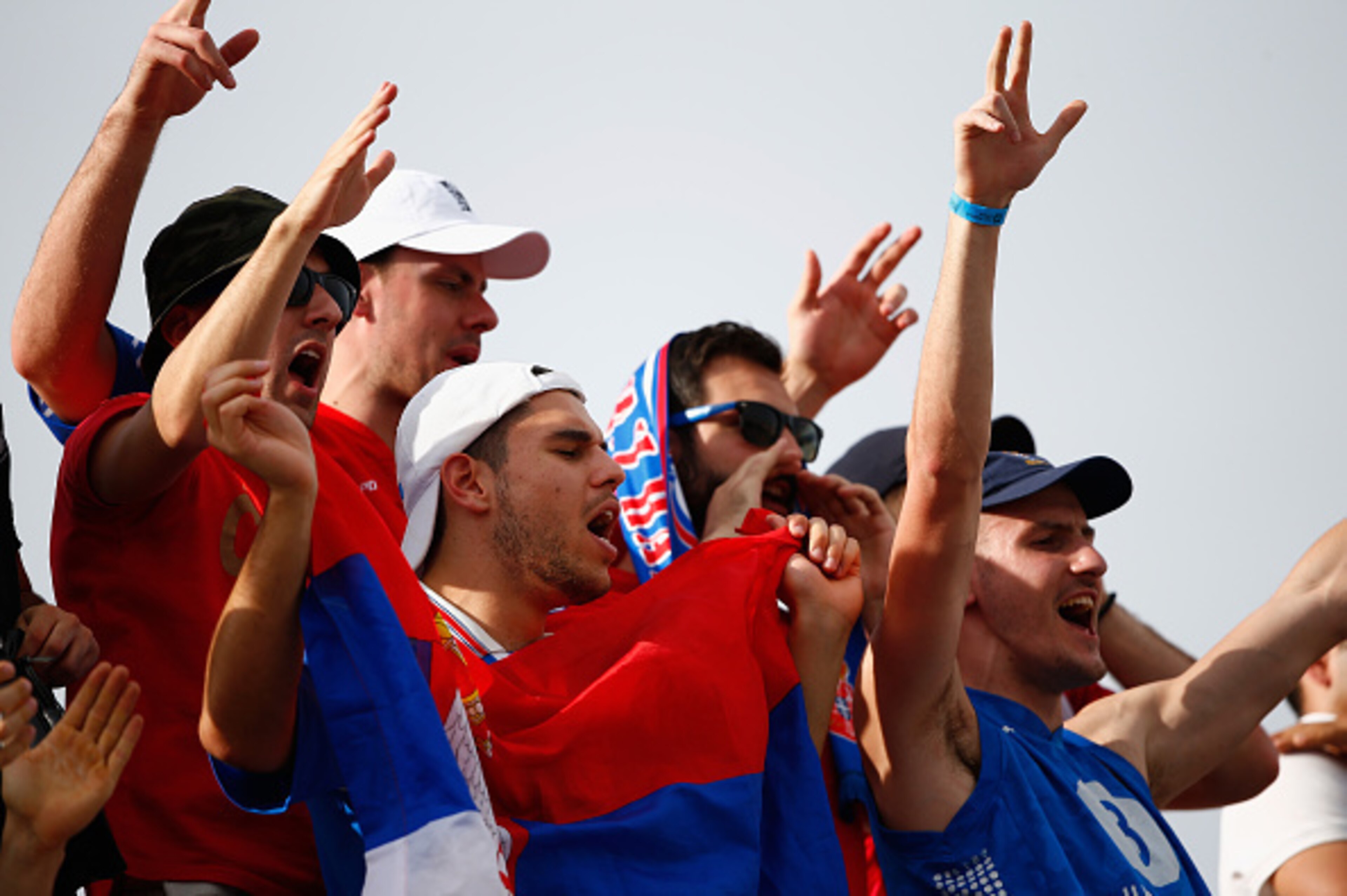 INDIAN WELLS, CA - MARCH 22:  Fans of Novak Djokovic of Serbia show their support against Roger Federer of Switzerland in the final during day fourteen of the BNP Paribas Open tennis at the Indian Wells Tennis Garden on March 22, 2015 in Indian Wells, Cal