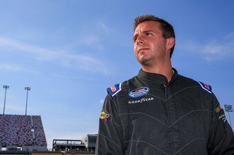 SPARTA, KY - SEPTEMBER 20: Matt DiBenedetto, driver of the #40 Curtis Key Plumbing Chevrolet, stands on the grid during qualifying for the the NASCAR Nationwide Series VisitMyrtleBeach.com 300 at Kentucky Speedway on September 20, 2014 in Sparta, Kentucky