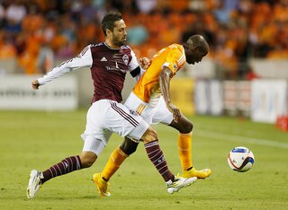 HOUSTON, TX - MARCH 28:  Marcelo Sarvas #11 of the Colorado Rapids battles for the ball with DaMarcus Beasley #7 of the Houston Dynamo during their game at BBVA Compass Stadium on March 28, 2015 in Houston, Texas.  (Photo by Scott Halleran/Getty Images)