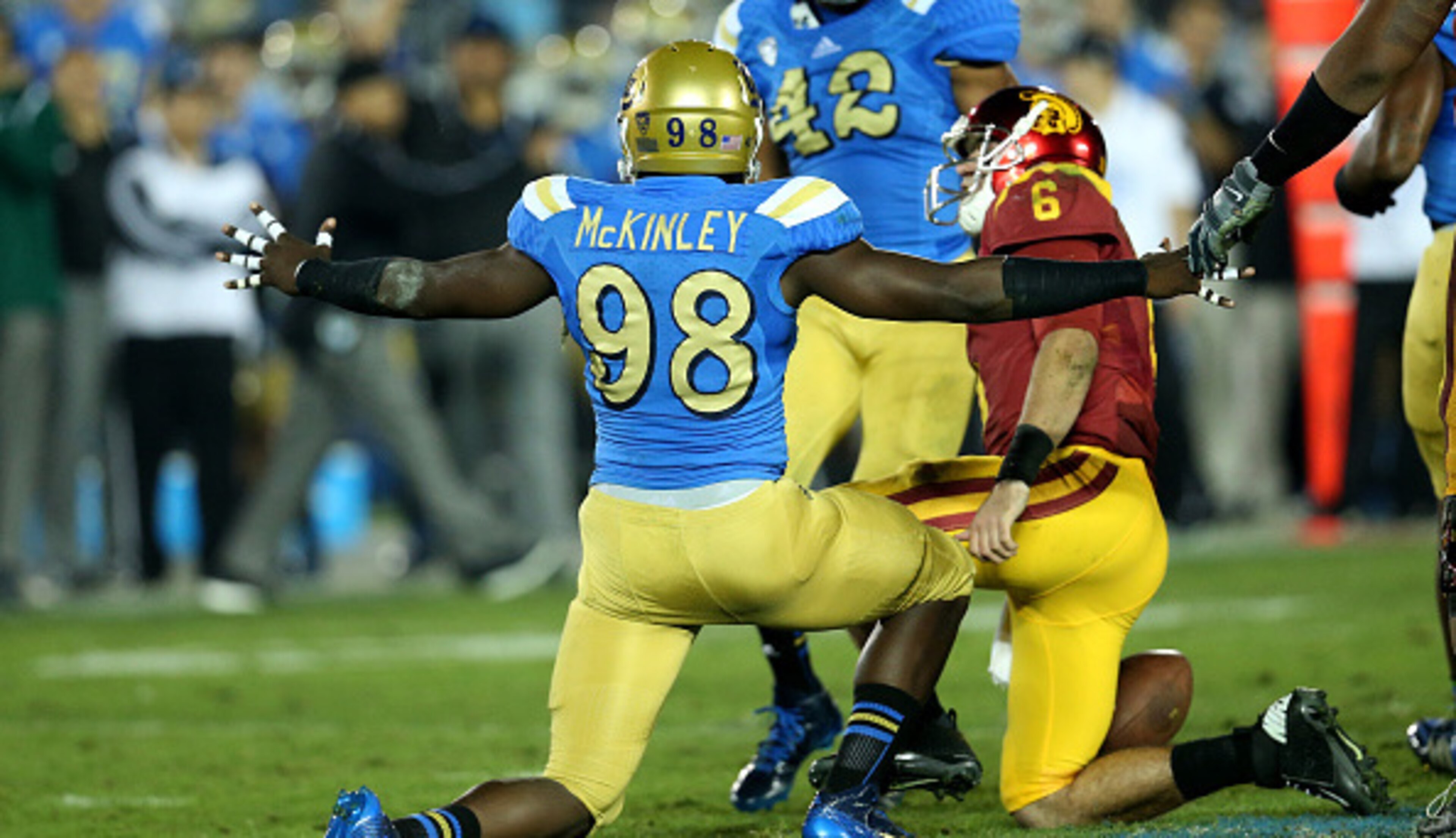 McKinley celebrating a sack versus Southern Cal.