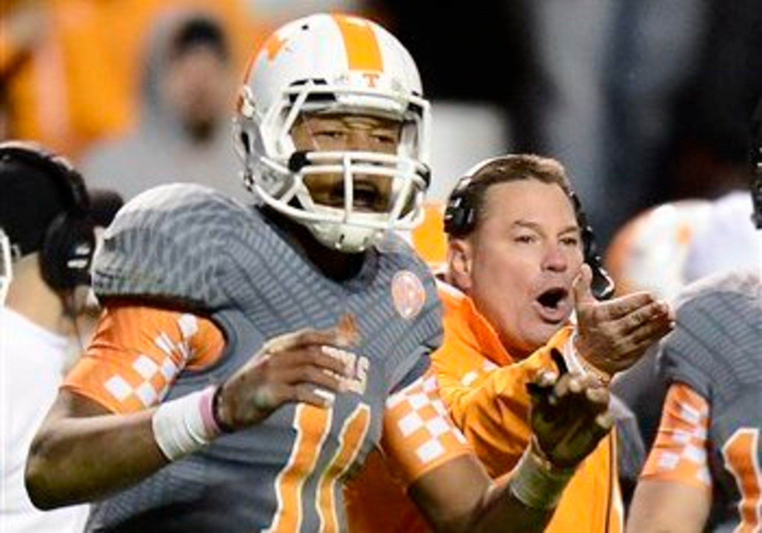 Tennessee QB Joshua Dobbs (left) and head coach Butch Jones (right)