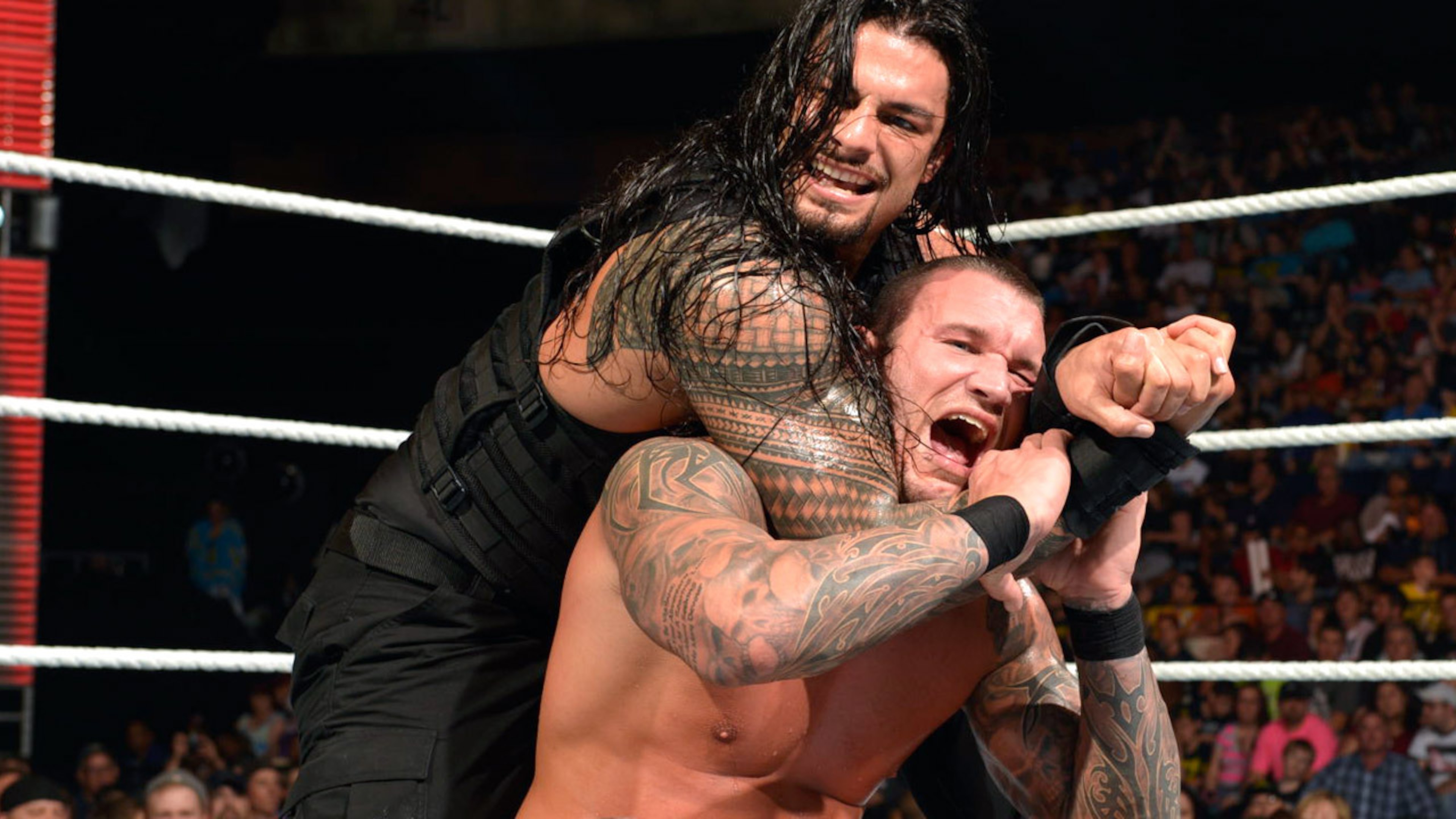 Roman Reigns battles Randy Orton.