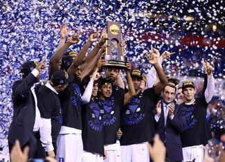 Duke's team hoists the 2015 NCAA national championship trophy.