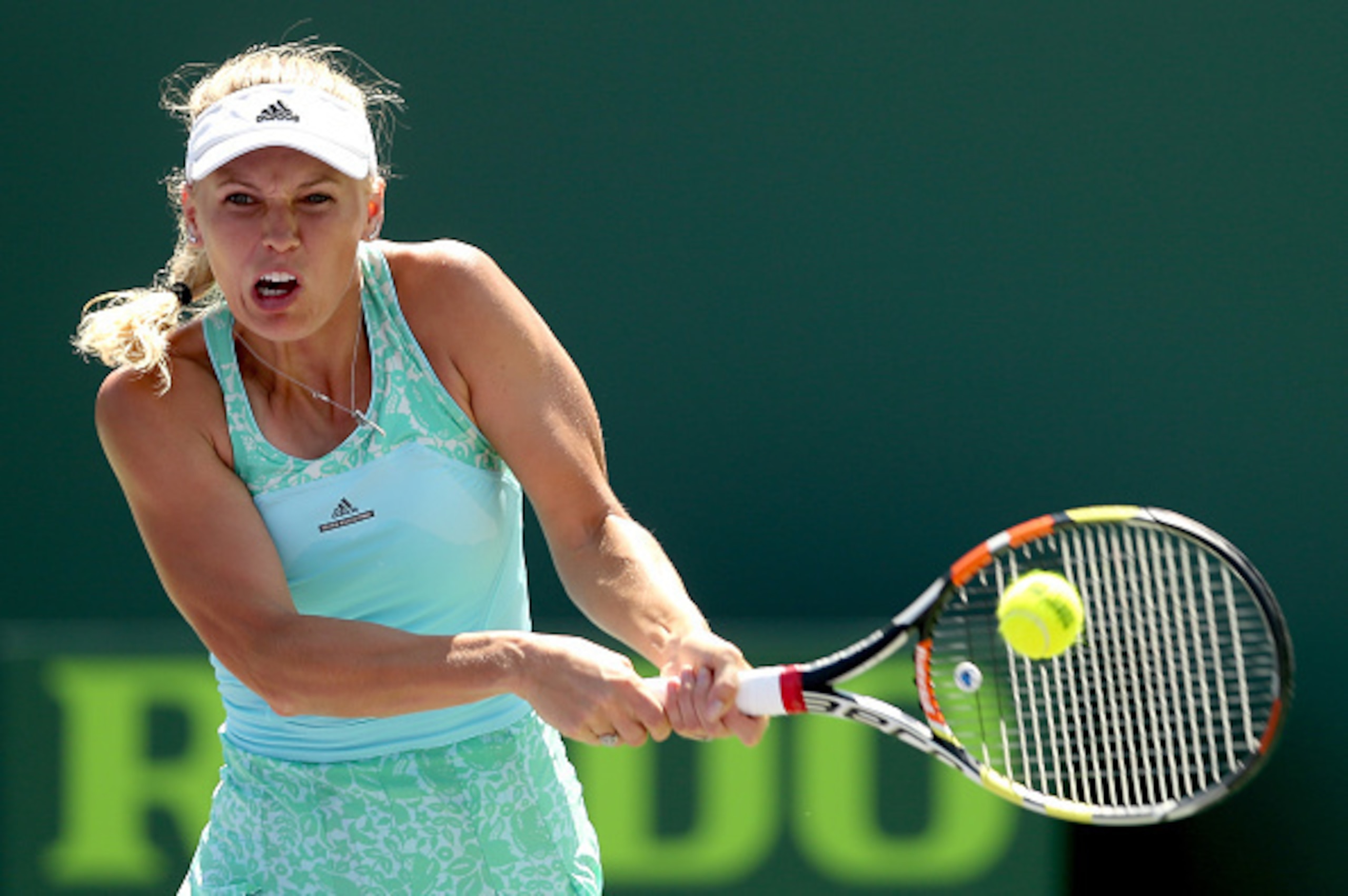 Caroline Wozniacki hits a backhand during her match against Venus Williams at the 2015 Miami Open.