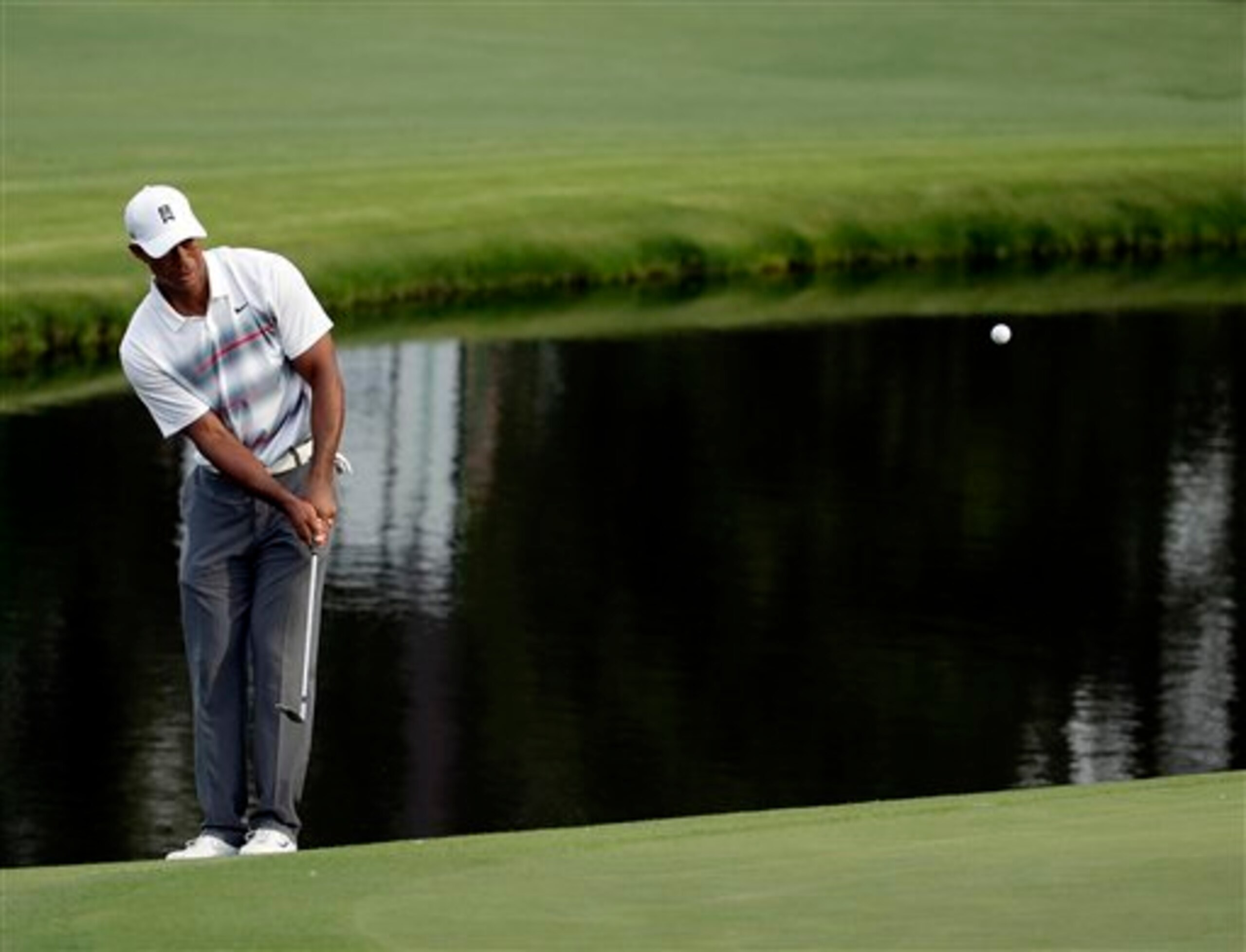 Tiger Woods had to grind overall in his opening round, but his short game was back.