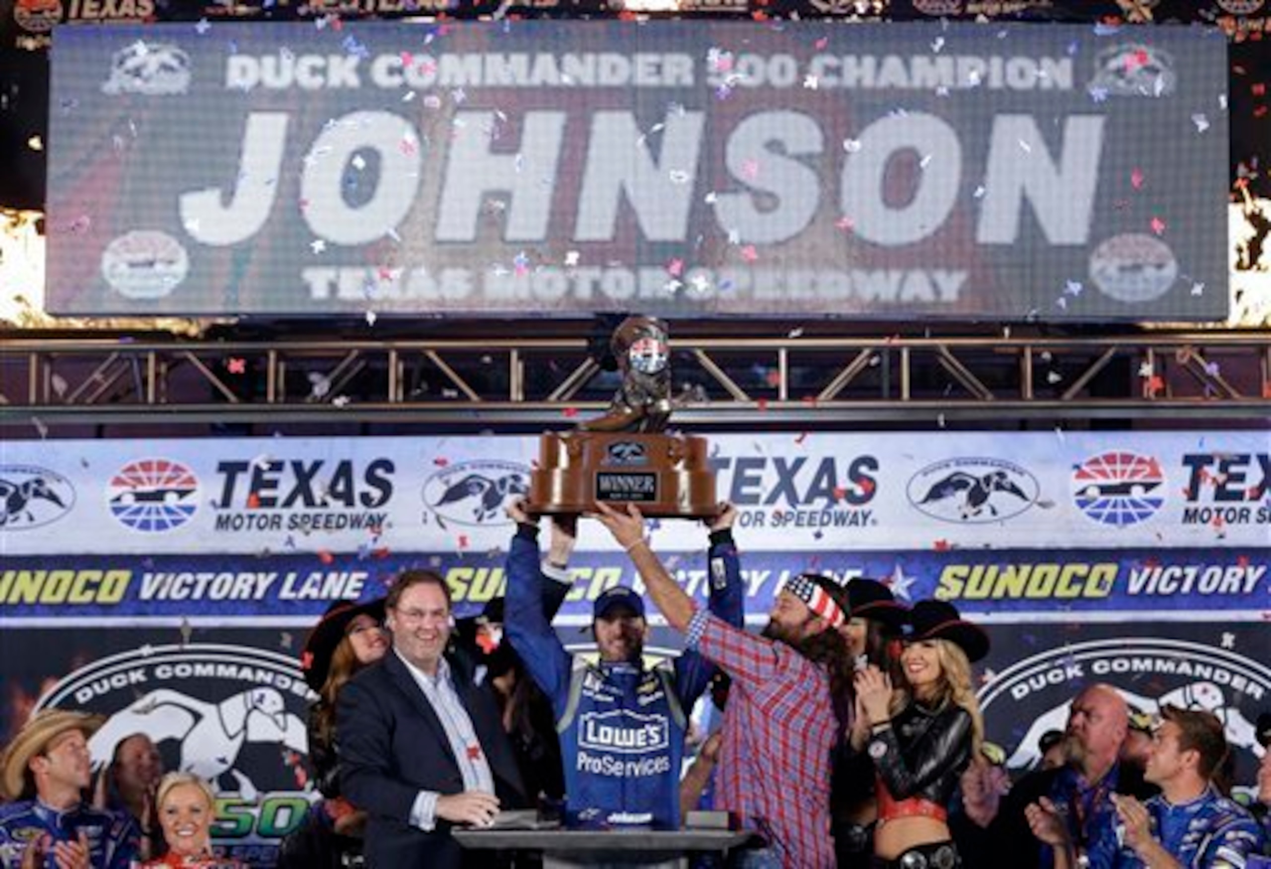 Johnson got a little help from some friends in hoisting the trophy at Texas.