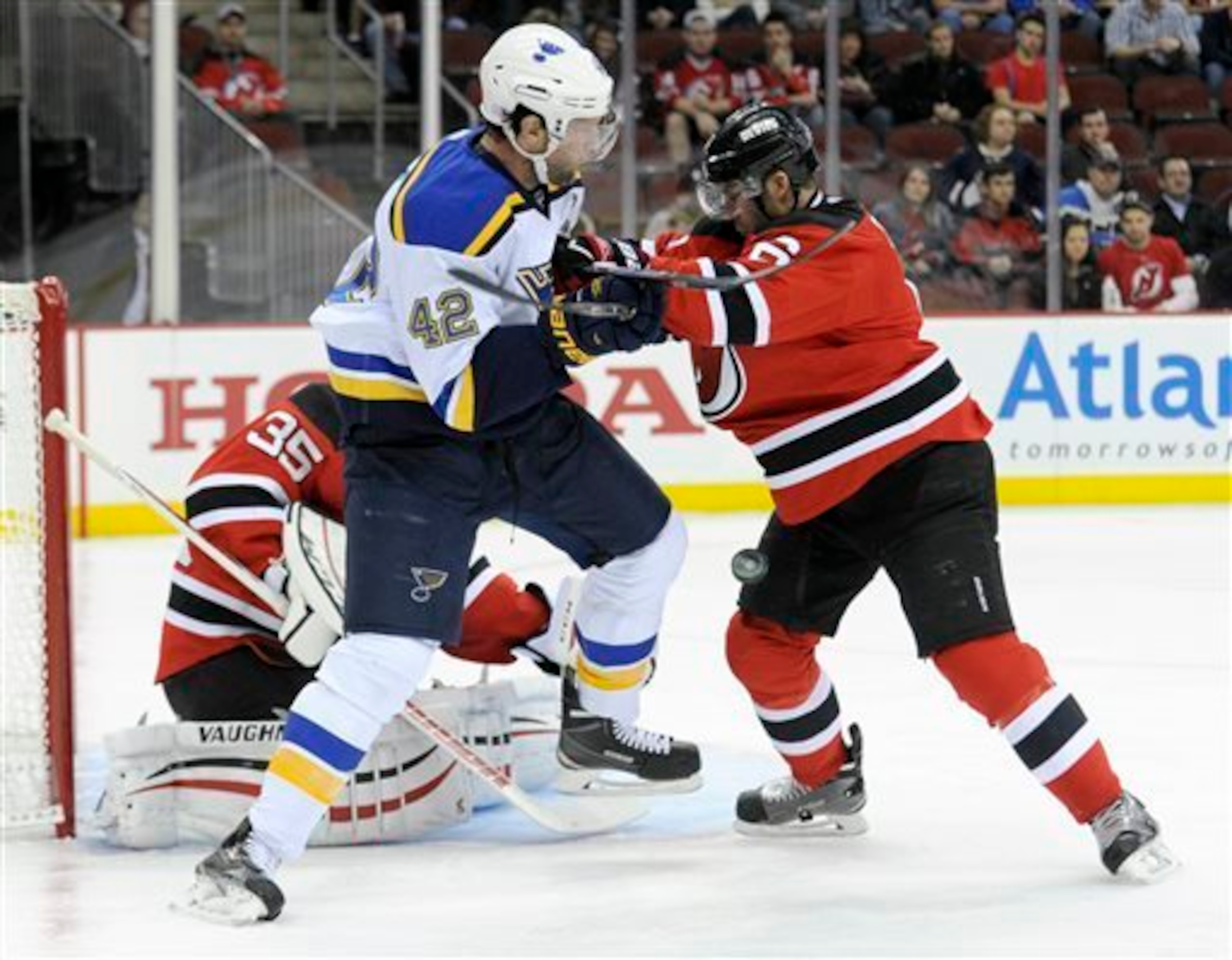 Andy Greene gets physical in front of the goal with David Backes of the St. Louis Blues. It is often Greene's job to do the dirty work against top players.
