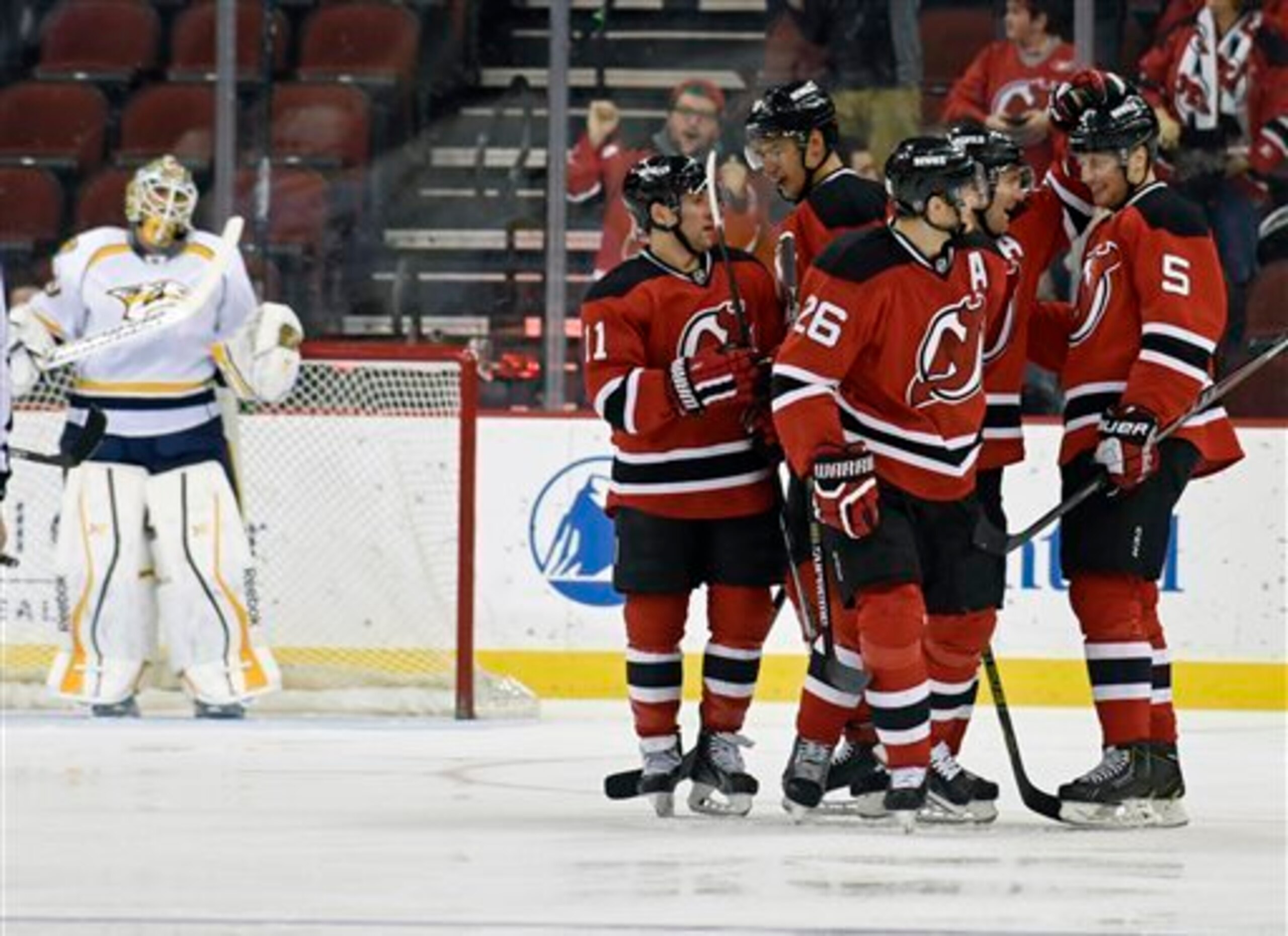 The Devils congratulate Adam Larsson on his third goal of the season.