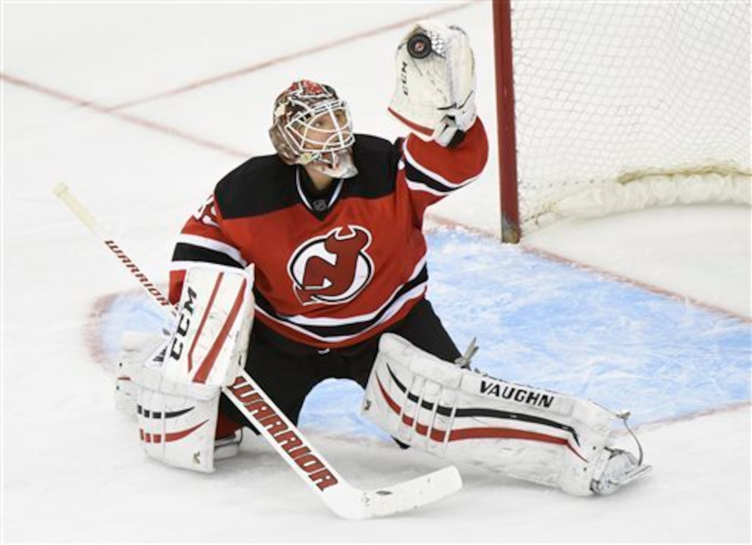 Cory Schneider makes a glove save.