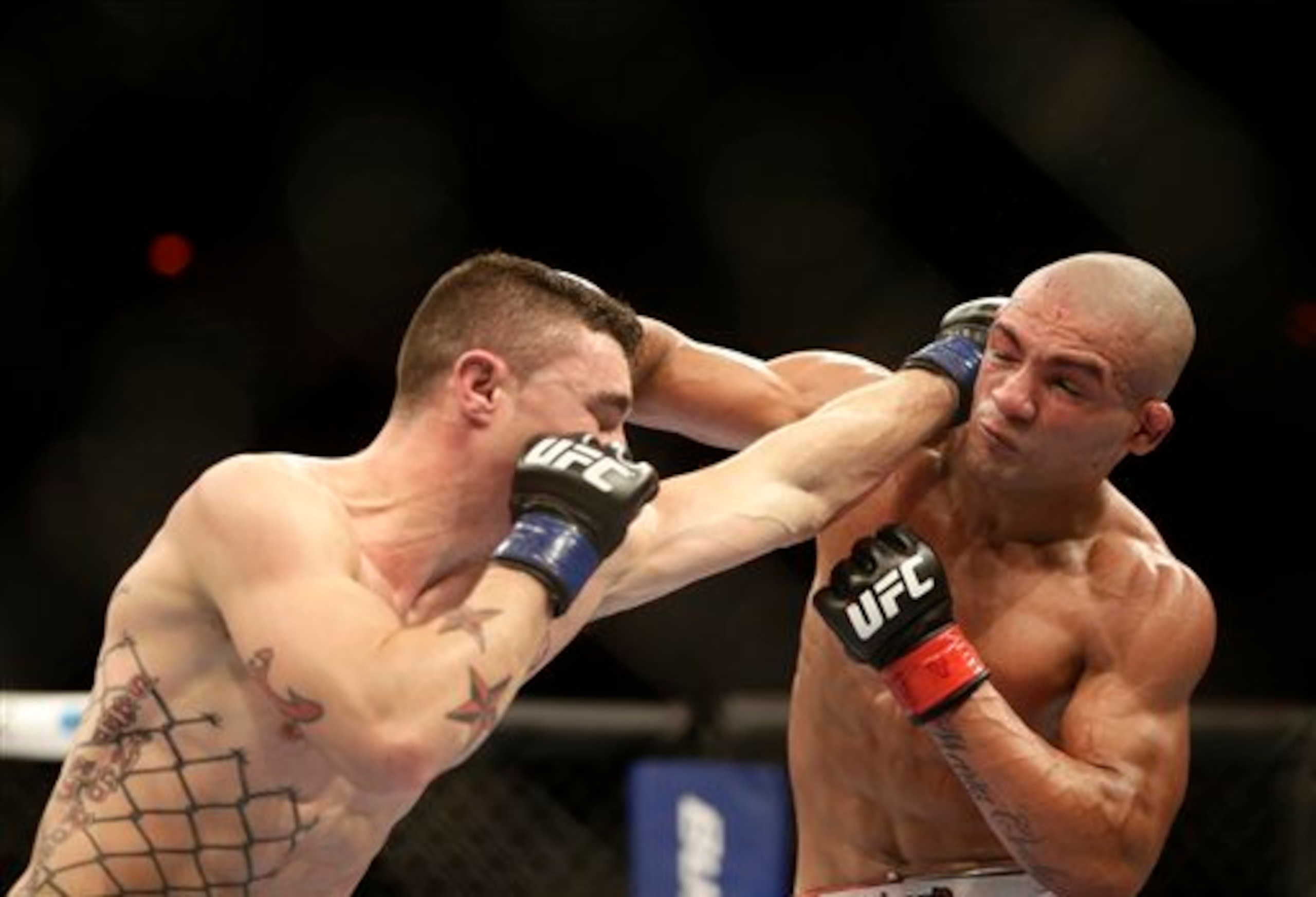 Joey Gambino, left, from the U.S., fights Diego Brandao, from Brazil, during their featherweight mixed martial arts bout at the Ultimate Fighting Championship (UFC) 153 in Rio de Janeiro, Brazil, Saturday Oct.  13, 2012. Brandao defeated Gambino. (AP Phot