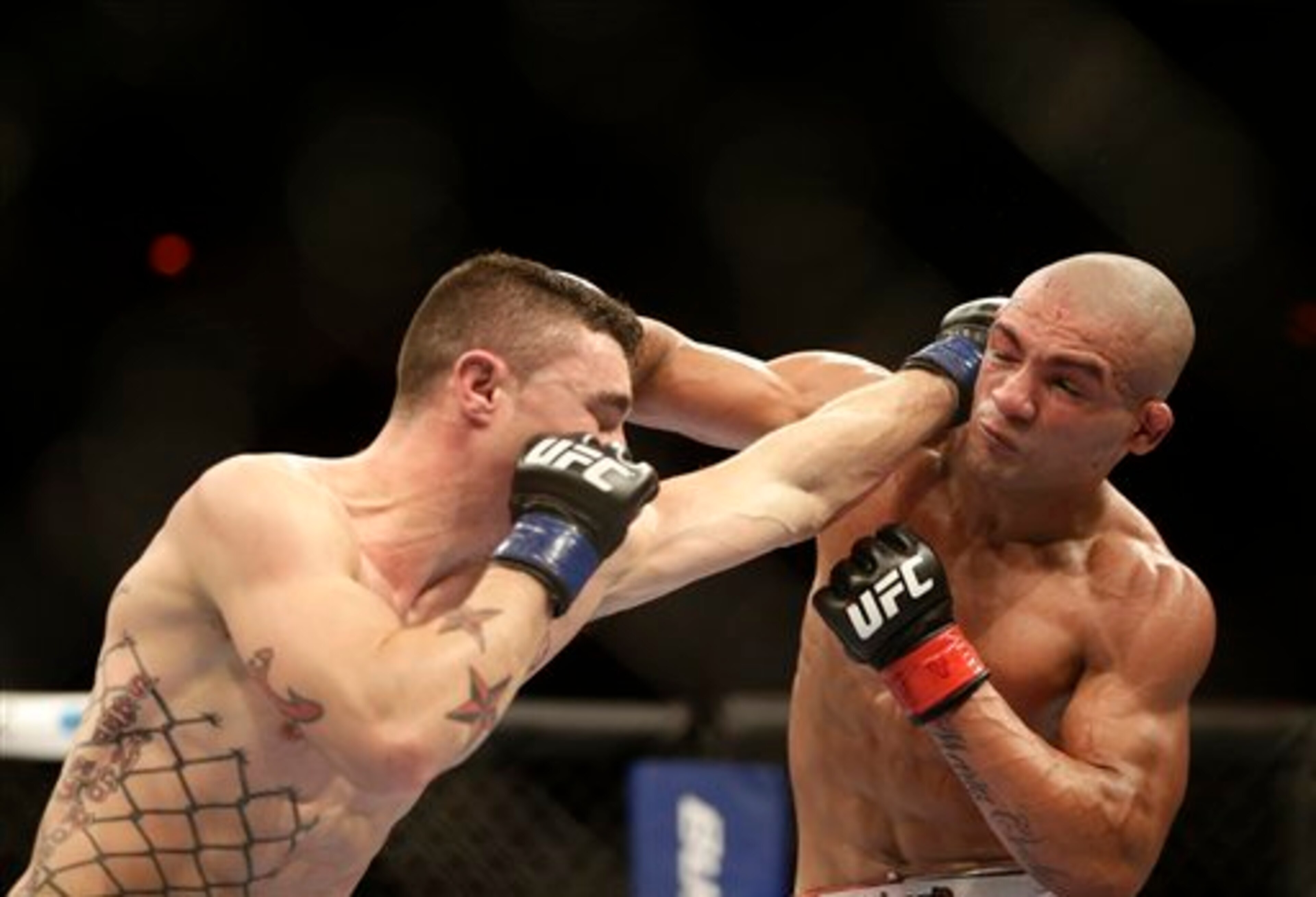 Joey Gambino, left, from the U.S., fights Diego Brandao, from Brazil, during their featherweight mixed martial arts bout at the Ultimate Fighting Championship (UFC) 153 in Rio de Janeiro, Brazil, Saturday Oct.  13, 2012. Brandao defeated Gambino. (AP Phot