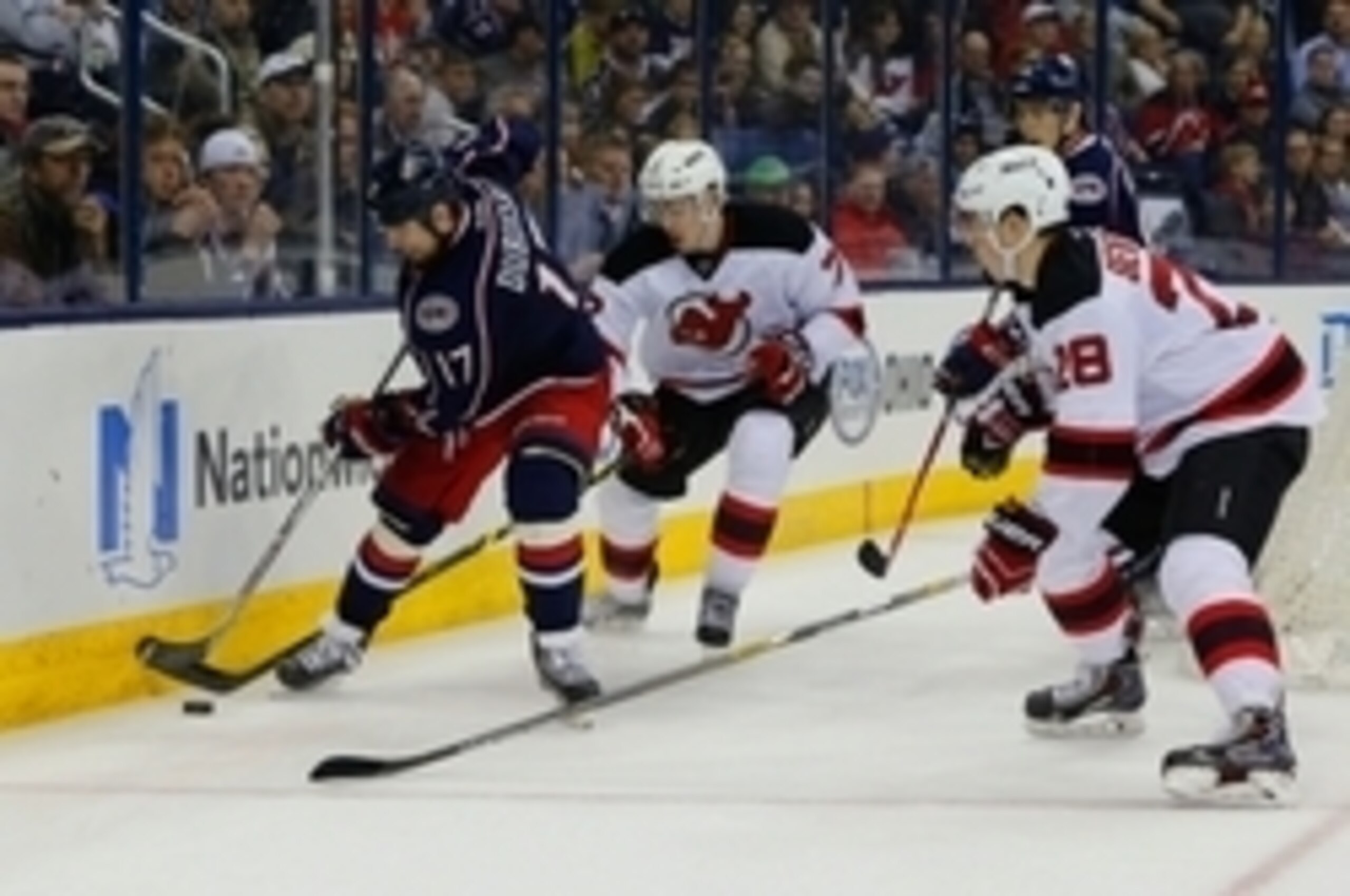 Jon Merrill and Damon Severson, two young defenders who could be traded this offseason, try to make a defensive play behind the net. Jon Merrill and Damon Severson, two young defenders who could be traded this offseason, try to make a defensive play behind the net.