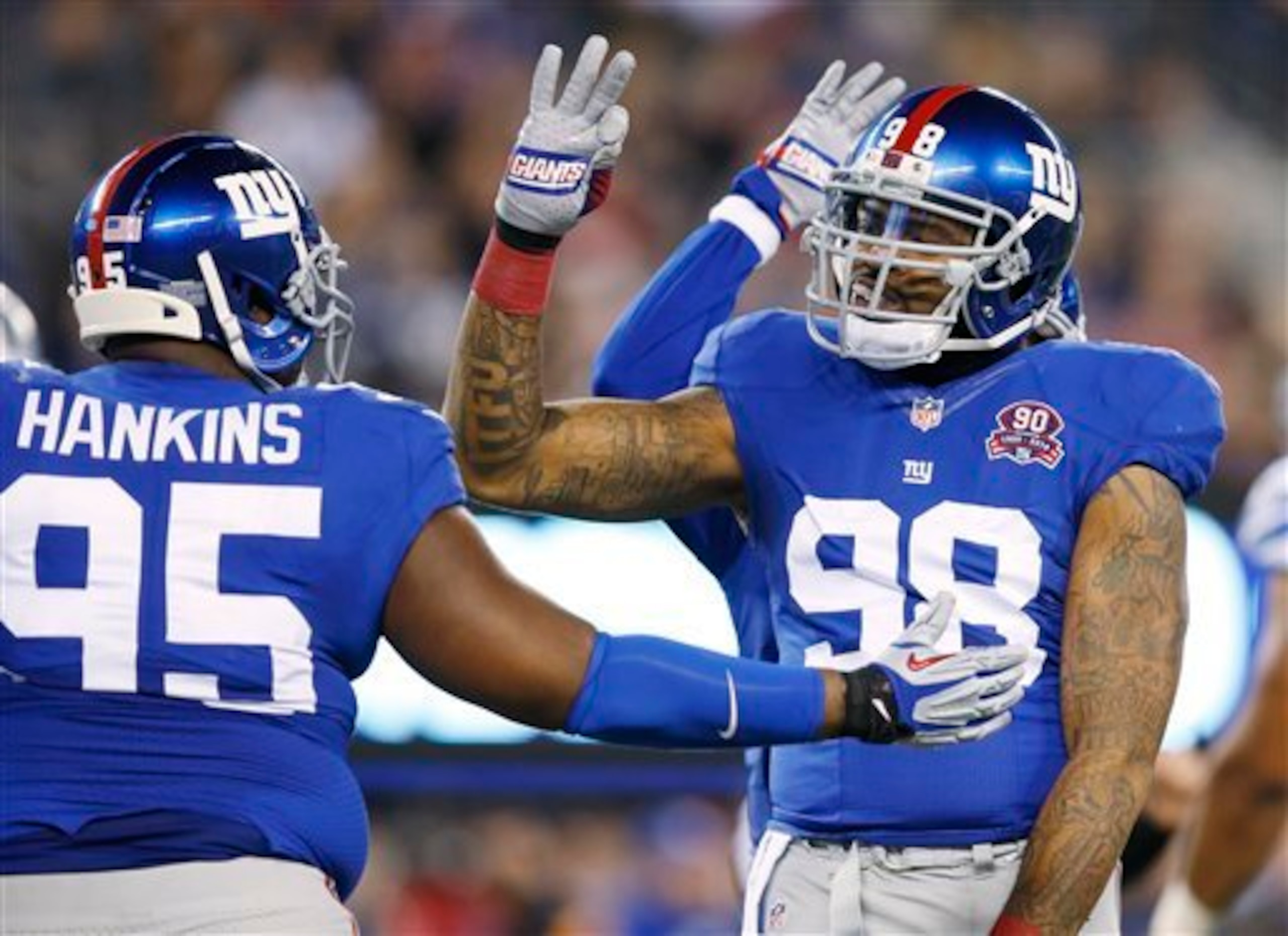 DT Johnathan Hankins and DE Damontre Moore.