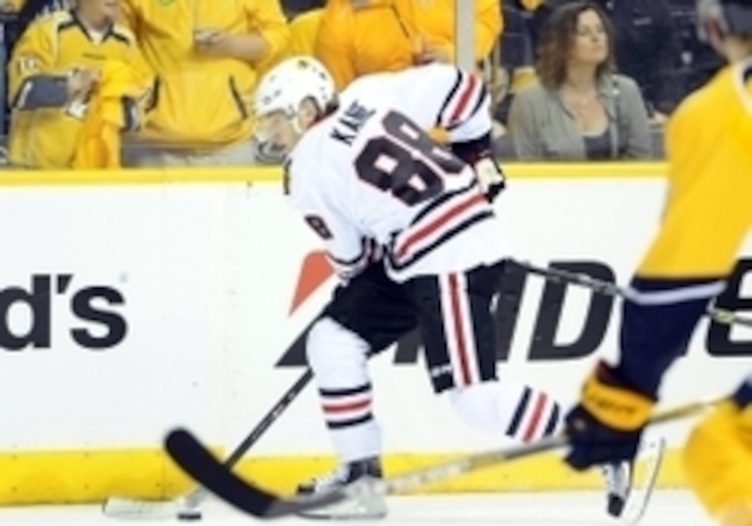 Kane's positioning helps him shield the puck.