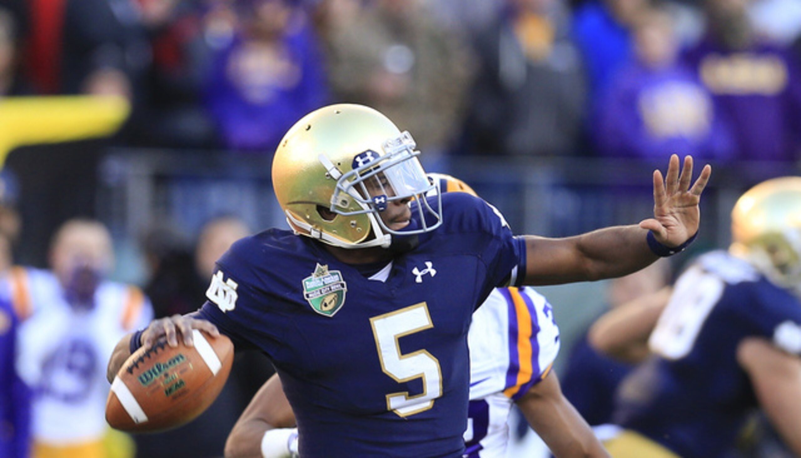 Golson making a throw down the field.