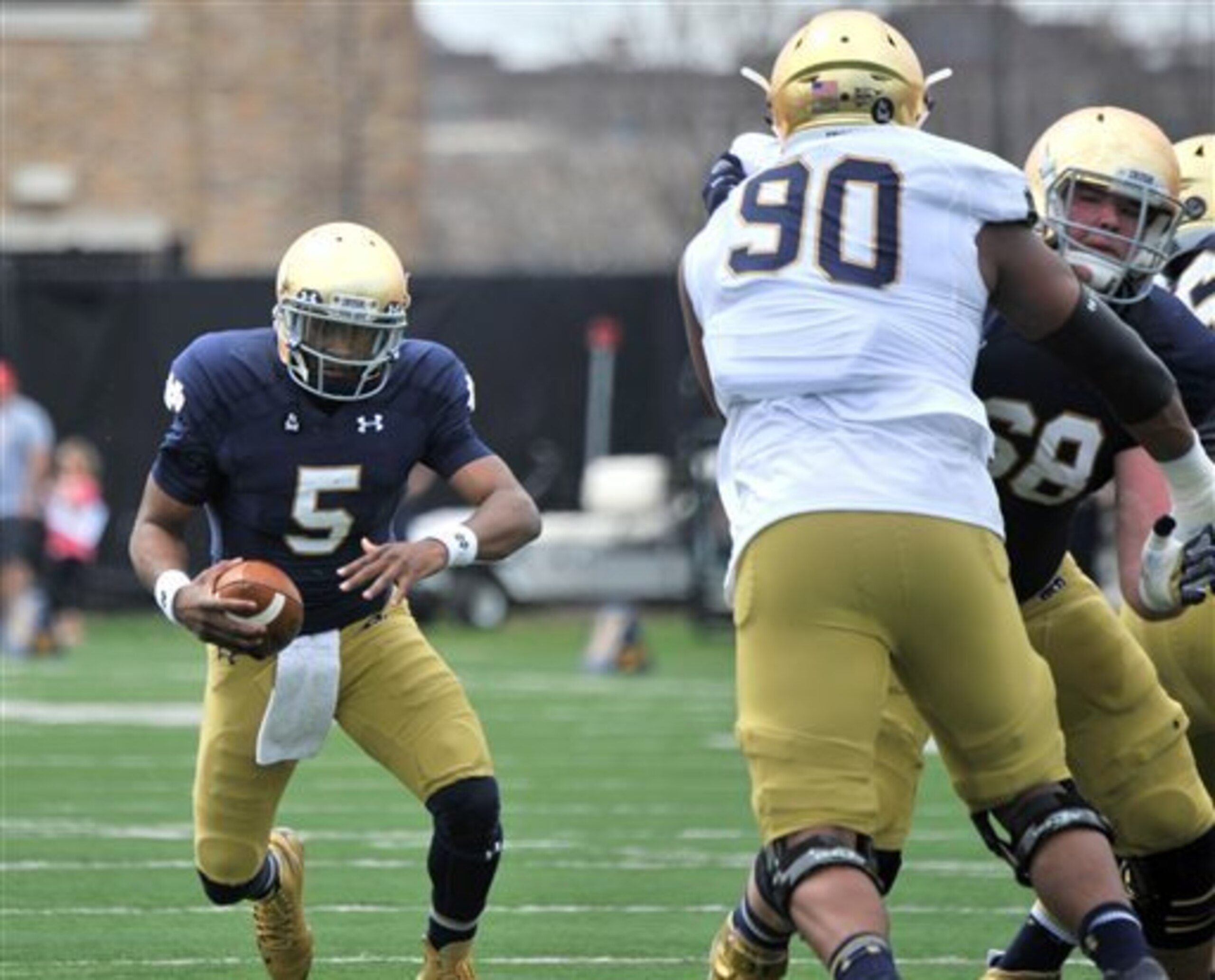 Everett Golson's competition with Malik Zaire for Notre Dame's starting role will continue into fall.
