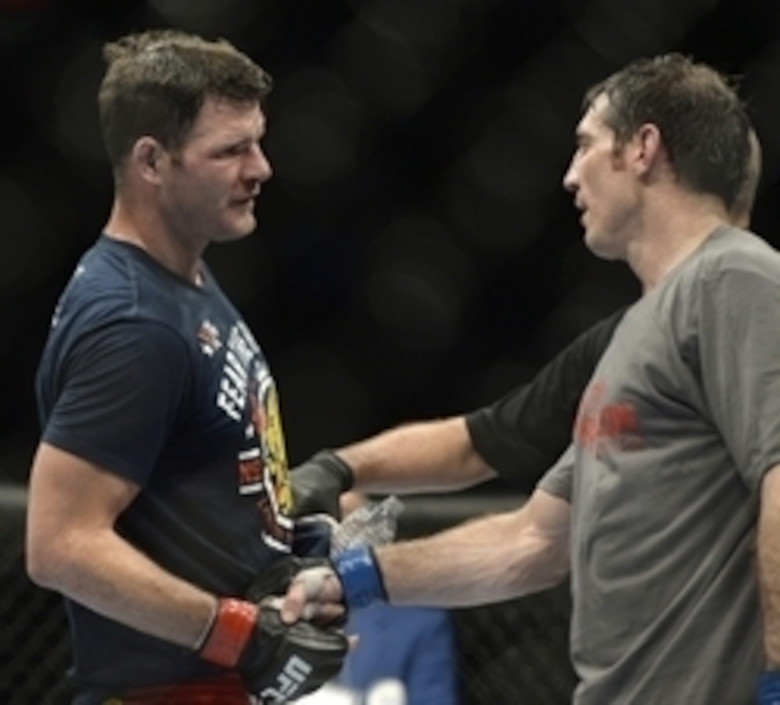 Apr 16, 2014; Quebec City, Quebec, Canada; Michael Bisping (red gloves) shakes hands with Tim Kennedy (blue gloves) after their middleweight bout at Colisee Pepsi. Mandatory Credit: Eric Bolte-USA TODAY Sports