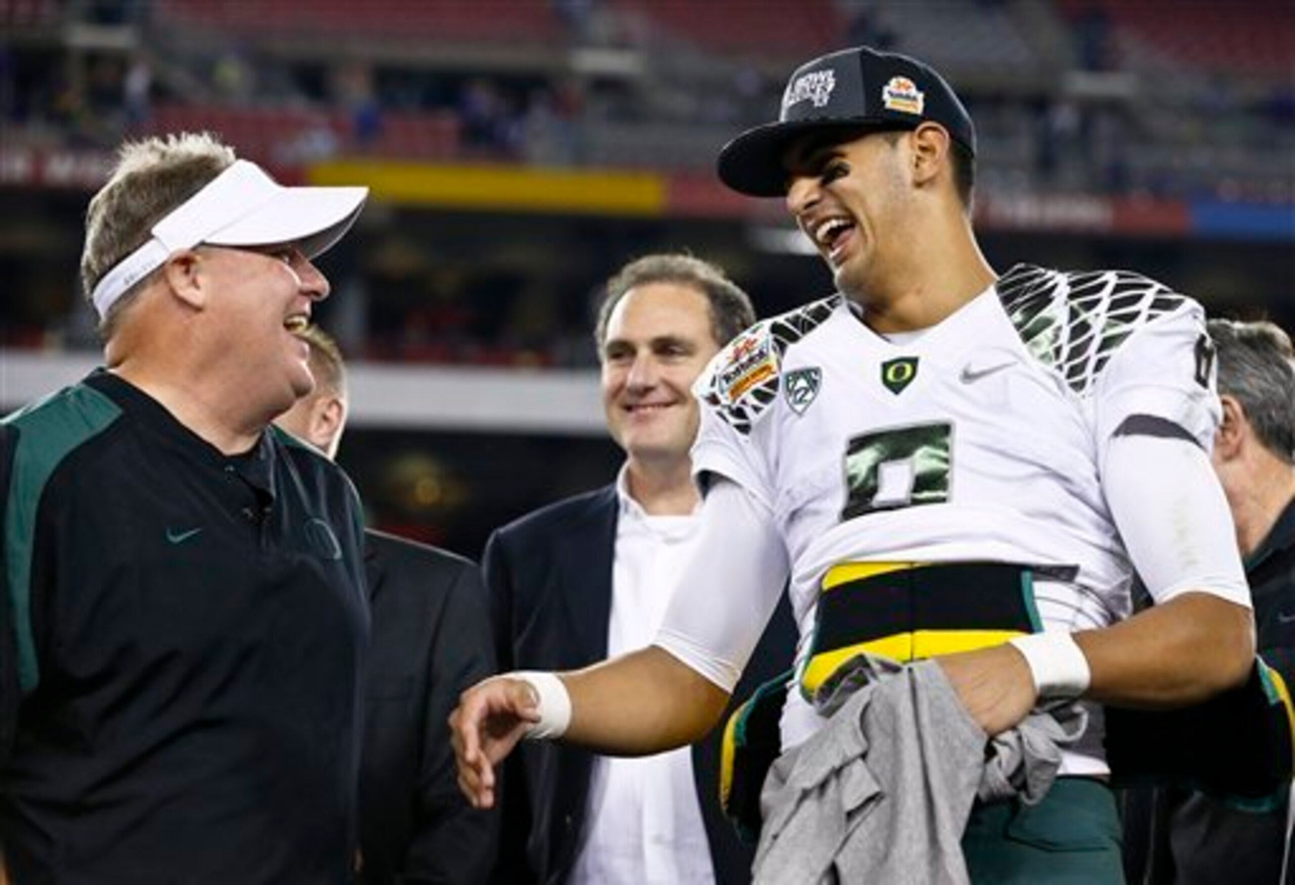 Oregon QB Marcus Mariota, with former coach Kelly Oregon QB Marcus Mariota, with former coach Kelly