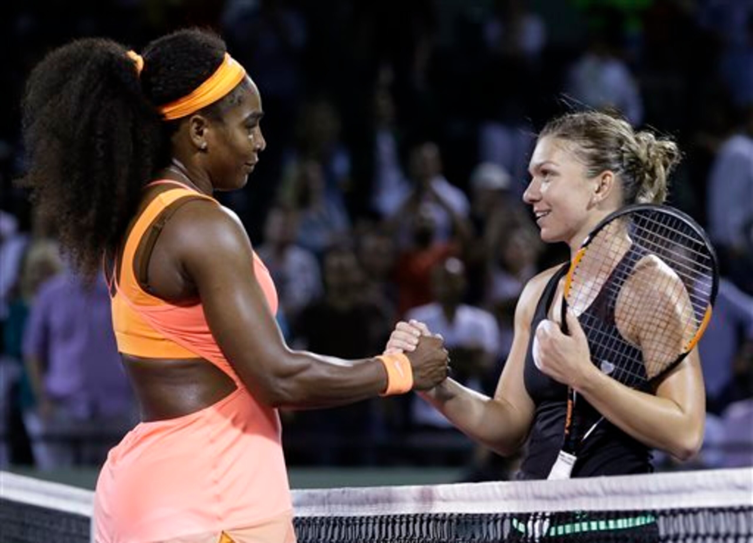 Serena Williams shakes hands with Simona Halep after a semifinal match at the 2015 Miami Open.