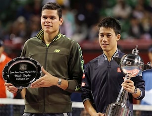 Milos Raonic and Kei Nishikori pose during trophy ceremony of the 2014 Japan Open.
