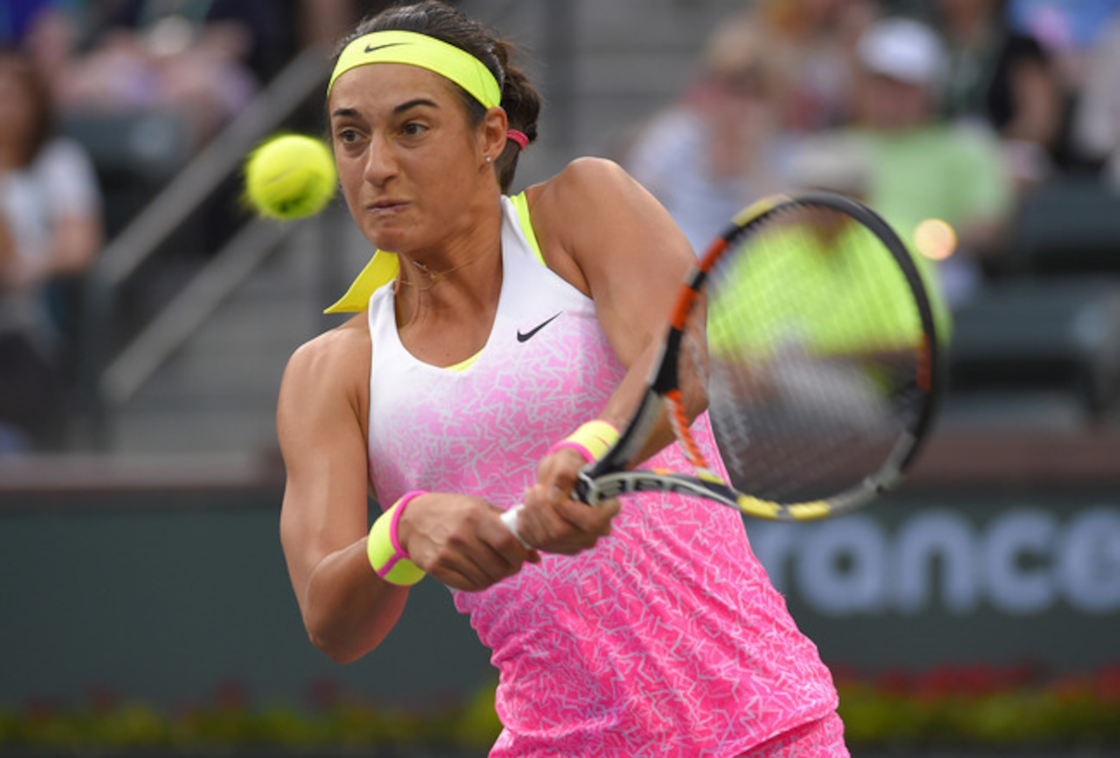 Caroline Garcia hits a backhand during a match at