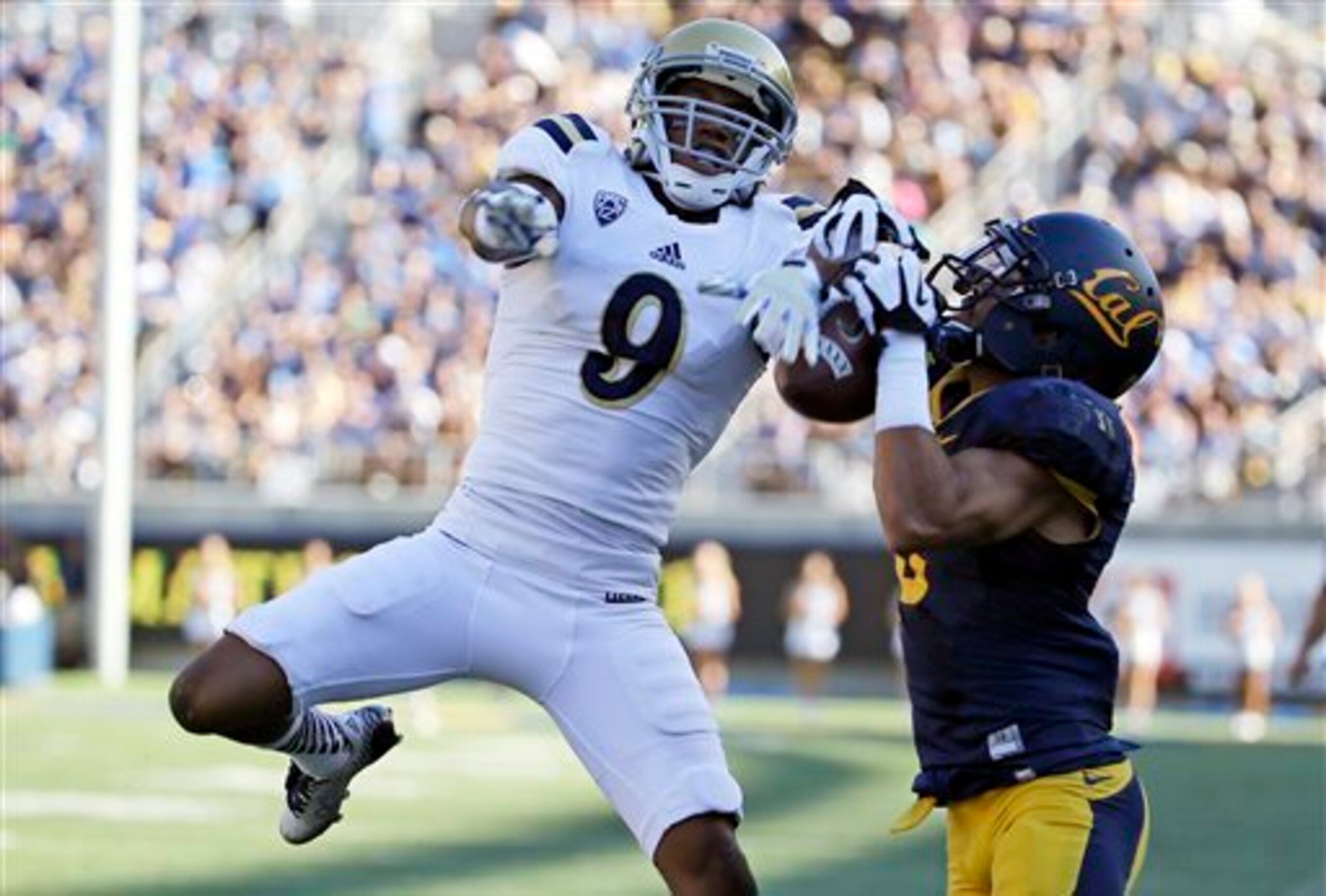 Defensive back Marcus Rios defending a pass against a Cal receiver.
