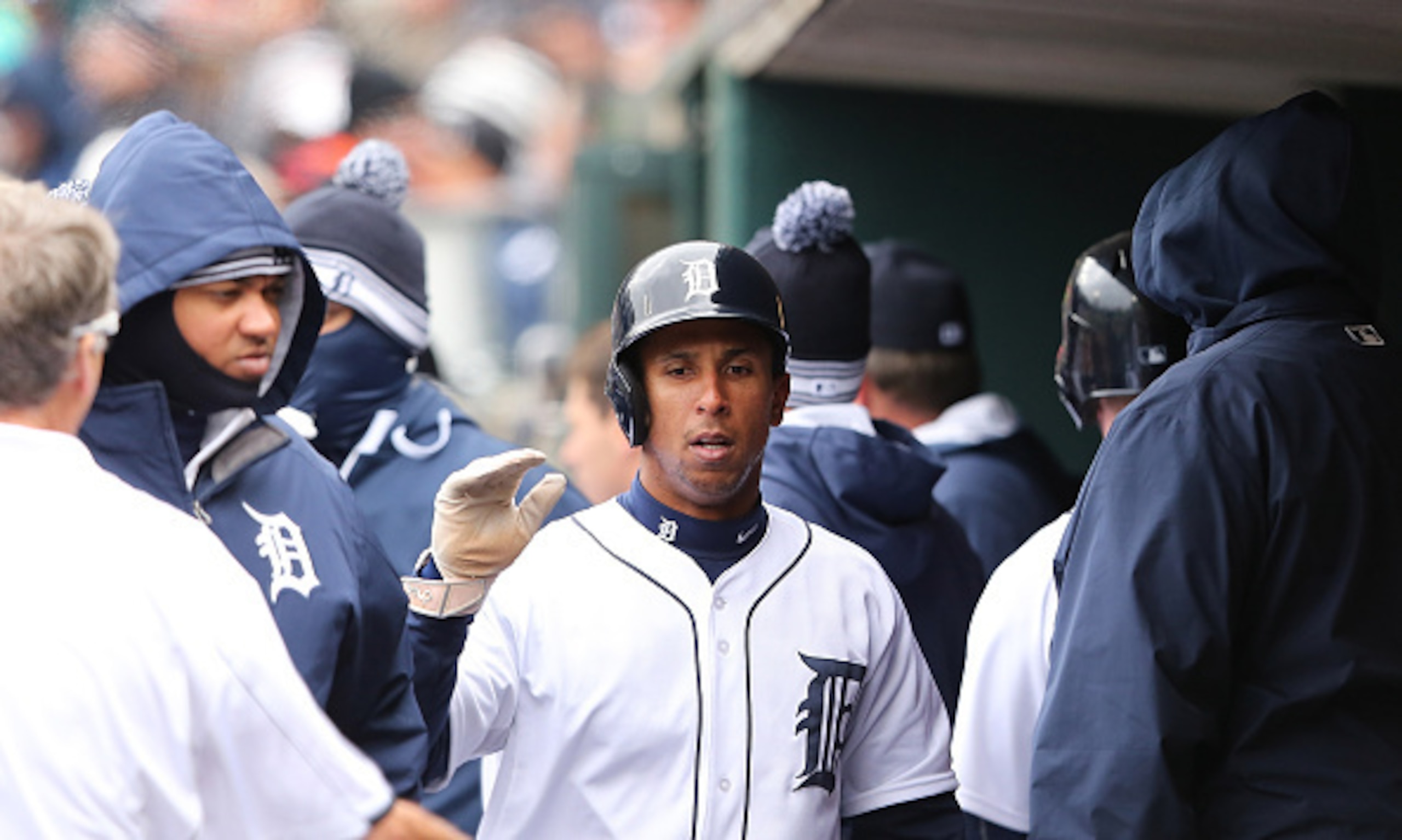 DETROIT, MI - APRIL 23: Anthony Gose #12 of the Detroit Tigers celebrates with his teammates in the dugout after scoring on the sacrifice fly to left field by Victor Martinez (not in photo) during the first inning of the game against the New York Yankees 