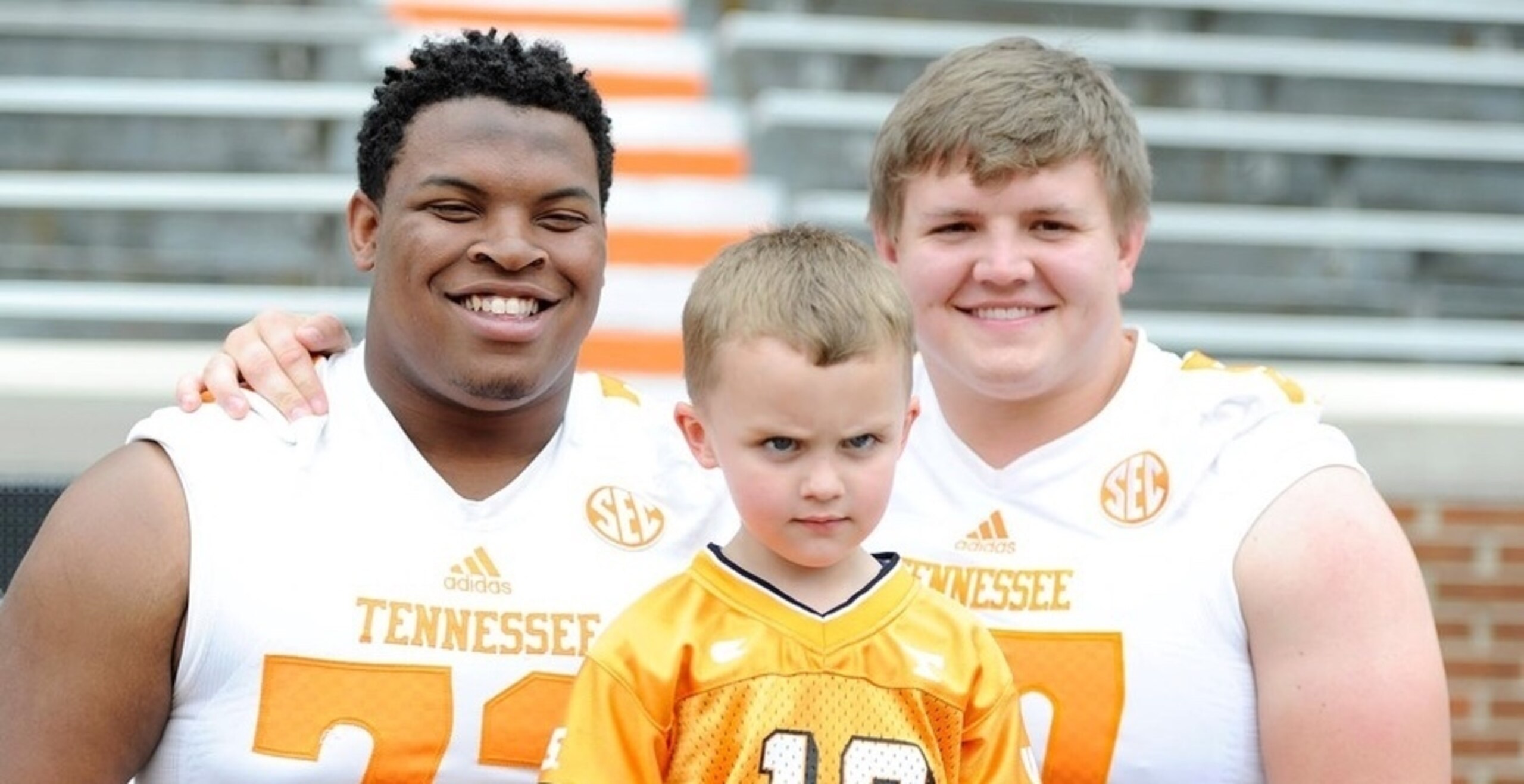 Jashon Robertson (left) and Mack Crowder (right) anchor a Vols offensive line that's improving. The kid in the middle? Well, he's just awesome.