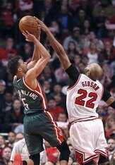 Gibson blocks the shot from Milwaukee's Michael Carter-Williams