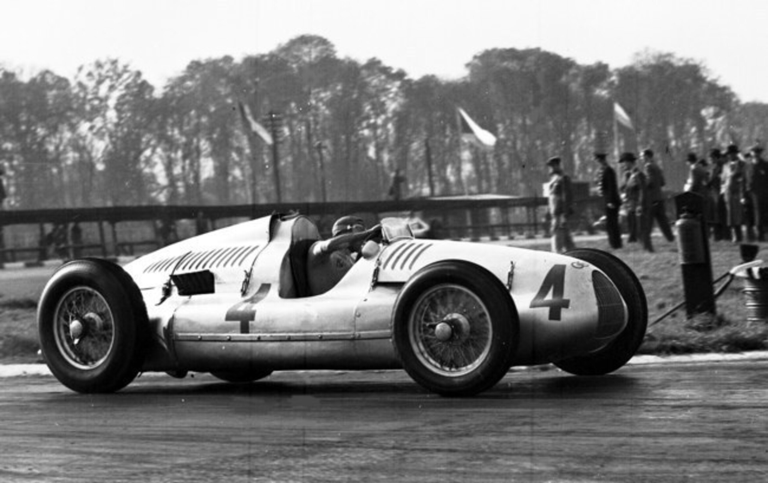 Tazio Nuvolari in an Auto Union at the 1938 Donington Grand Prix. Logo visible above the grille. Tazio Nuvolari in an Auto Union at the 1938 Donington Grand Prix. Logo visible above the grille.