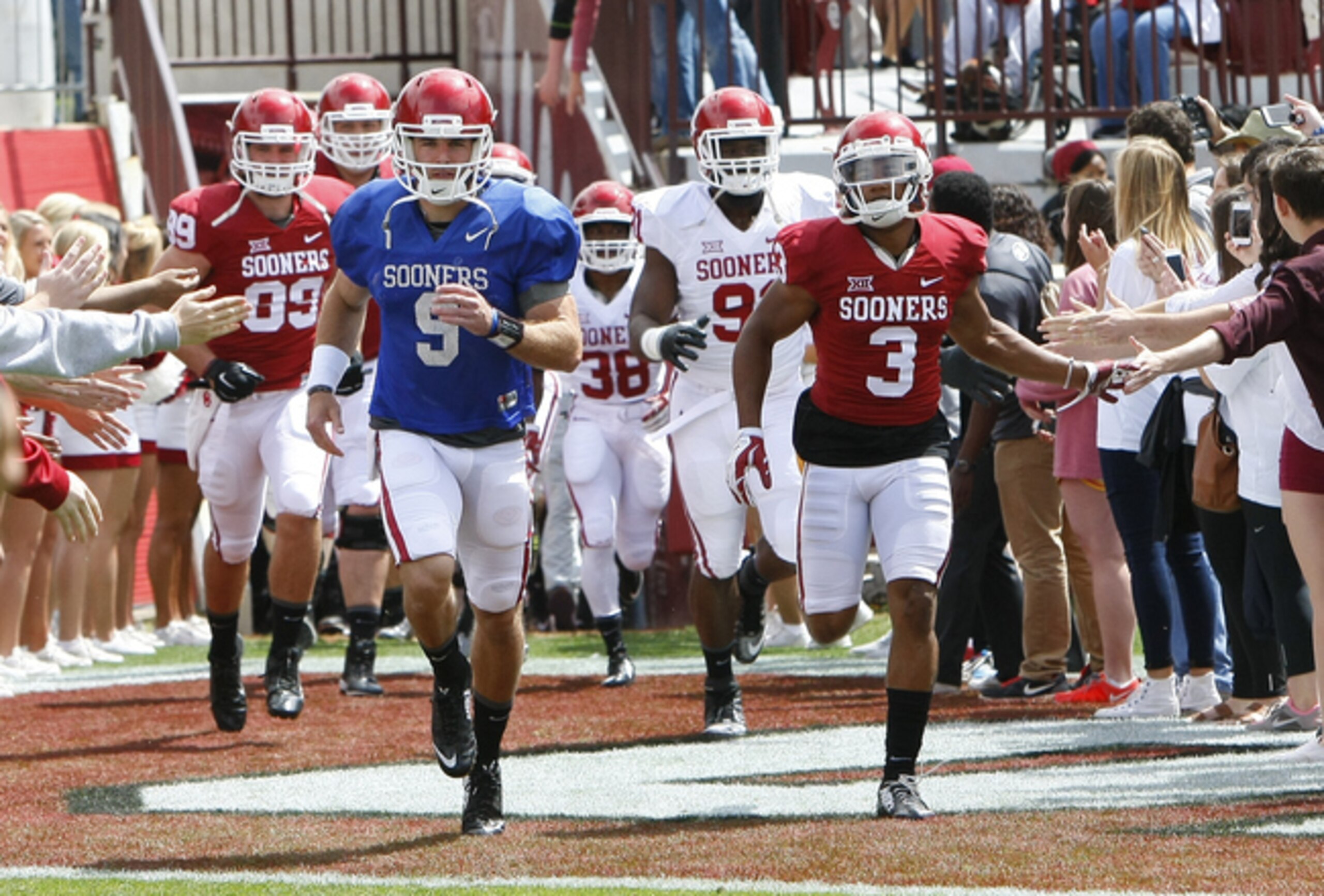 Oklahoma being greeted during its spring game.