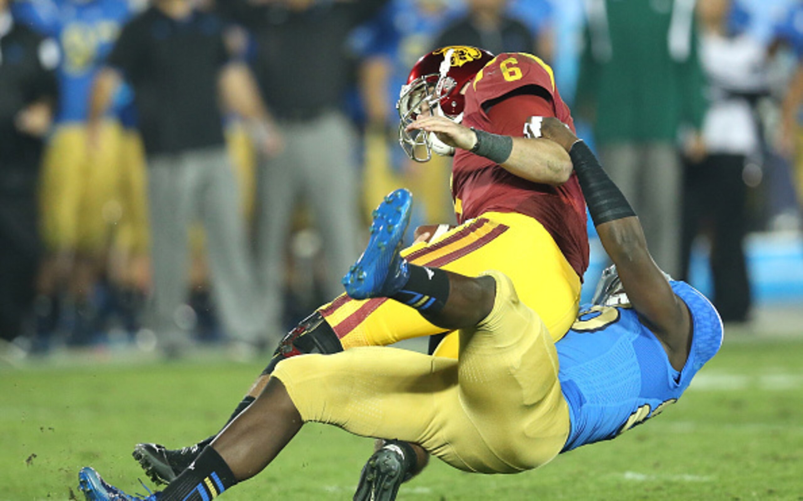 McKinley about to put the clamps on Southern Cal QB Cody Kessler.
