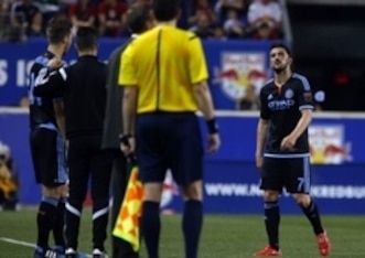 David Villa disappointedly makes way for Patrick Mullins.