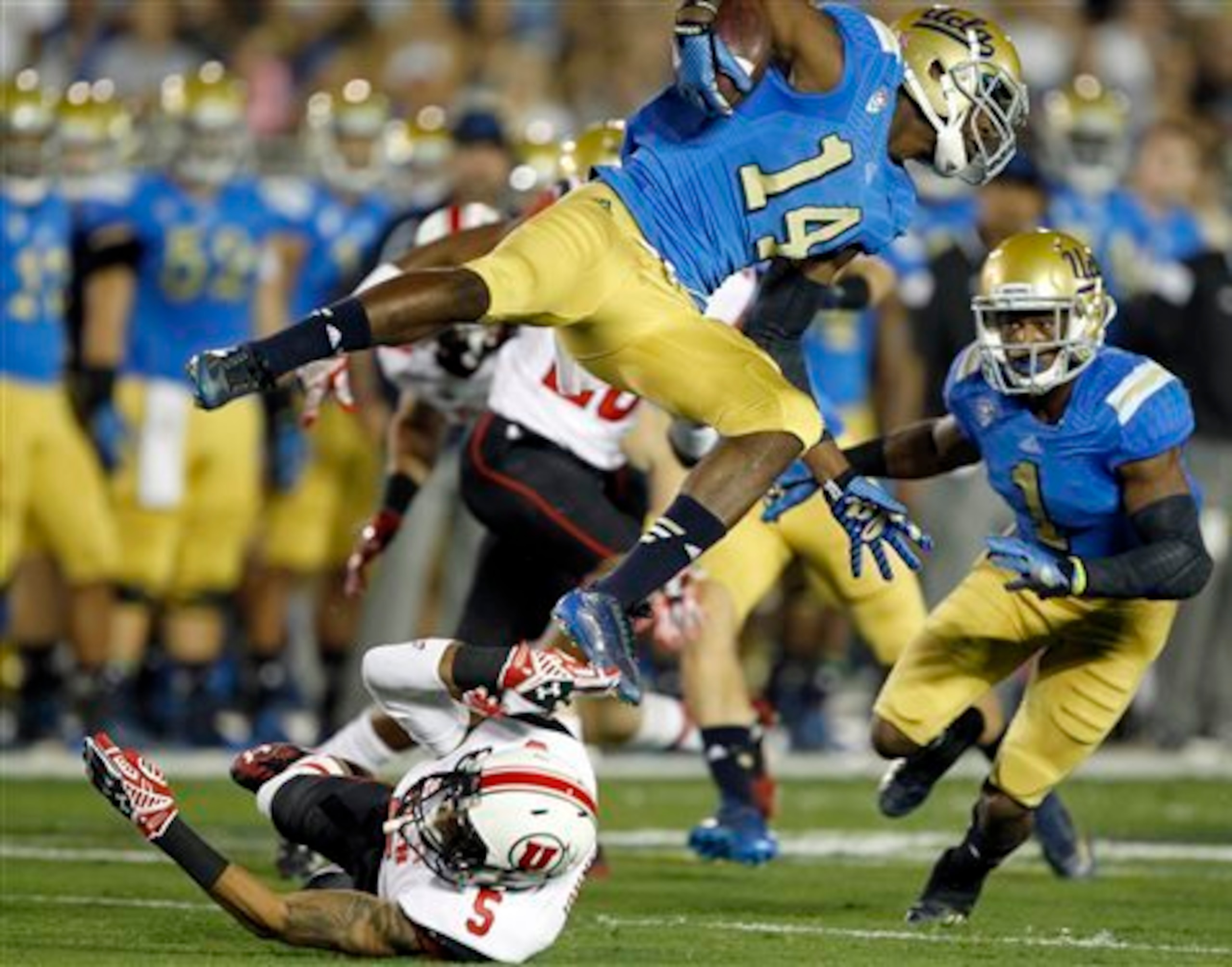 Mossi Johnson being upended in the open field.