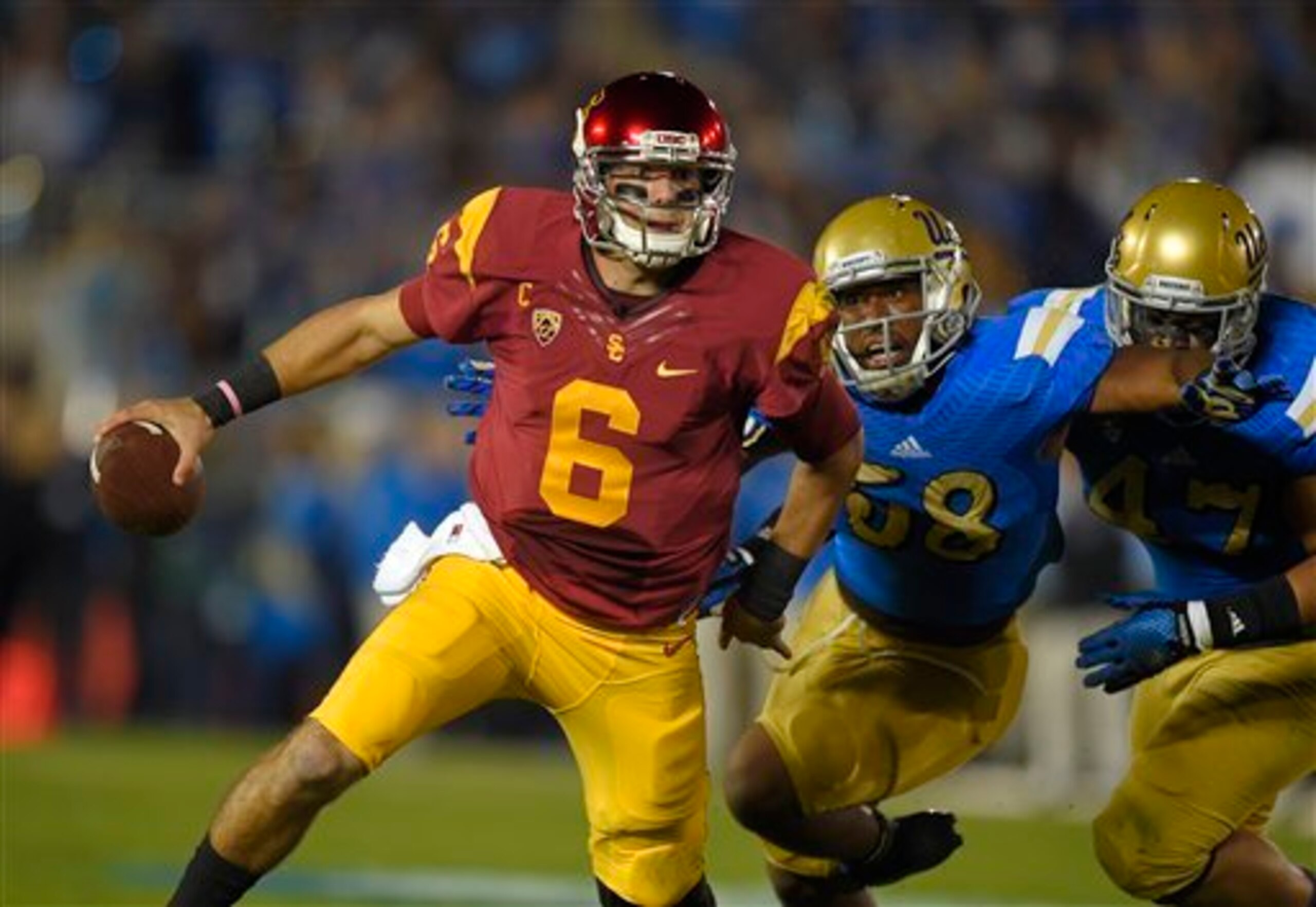 Deon Hollins trying to sack Cody Kessler.