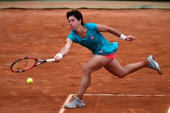 Carla Suarez Navarro tries to make a play on the ball during a match in Rome.