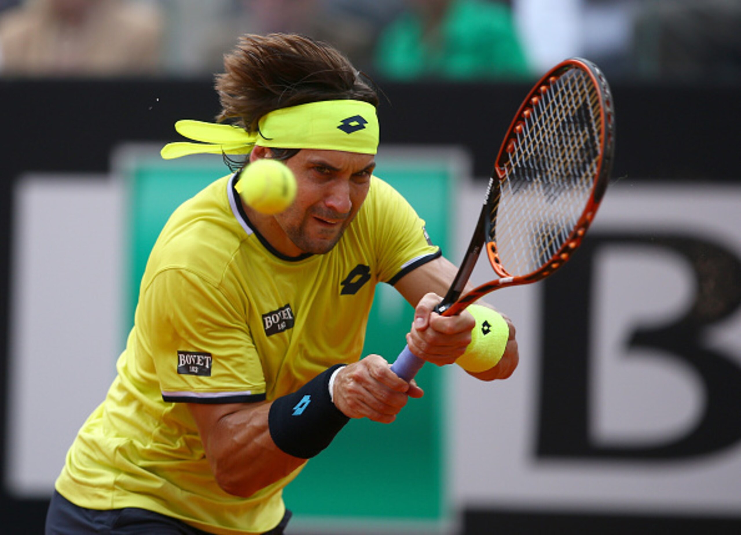 David Ferrer hits a backhand volley during a match at the 2015 Italian Open.